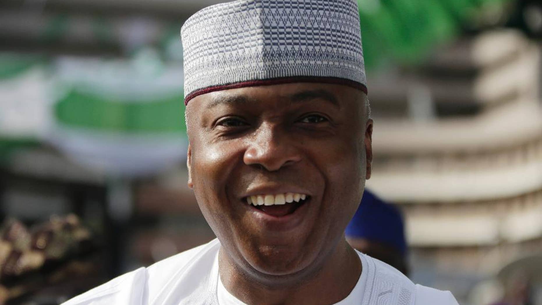 In this Photo taken Friday, May 29, 2015, Bukola Saraki, attends the Inauguration of the Nigerian President in Abuja, Nigeria. The former governor has been elected head of Nigeria's Senate Tuesday, June 9, 2015, becoming the third most powerful person in the country by challenging the wishes of the presidential coalition to which he belongs. Bukola Saraki's victory highlights the cracks appearing in the coalition that brought President Muhammadu Buhari to power. (AP Photo/Sunday Alamba)