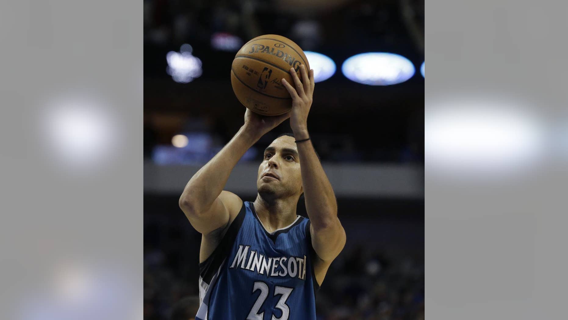 Minnesota Timberwolves guard Kevin Martin (23) shoots a free throw during the second half of an NBA basketball game against the Dallas Mavericks, Saturday, Nov. 15, 2014, in Dallas. (AP Photo/LM Otero)