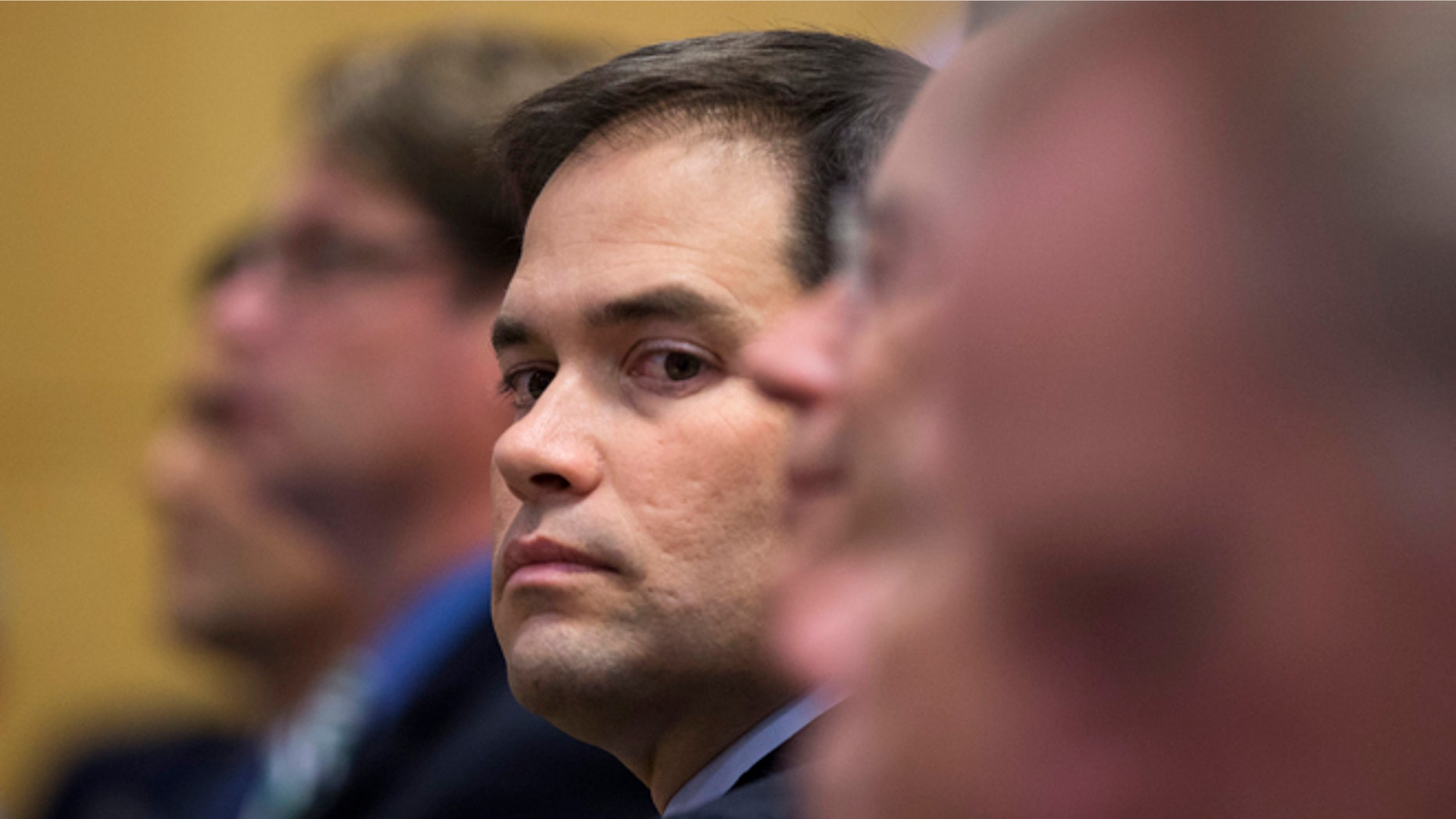 Sen. Marco Rubio, R-Fla., looks out from his seat before speaking at Catholic University of America, in Washington, Wednesday, July 23, 2014. Trying to win forgiveness for pushing a failed immigration overhaul, Rubio is rushing to woo social conservatives ahead of a potential 2016 White House run. While Rubio has consistently held conservative positions on abortion and gay marriage, his emphasis now is an effort to find support among social conservatives who have yet to settle on a favored candidate in the presidential campaign that is in its nascent stages. (AP Photo)