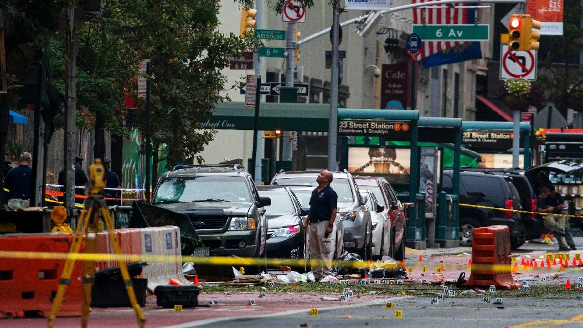 Sept. 18, 2016: Crime scene investigators work at the scene of Saturday's explosion in Manhattan's Chelsea neighborhood, in New York.