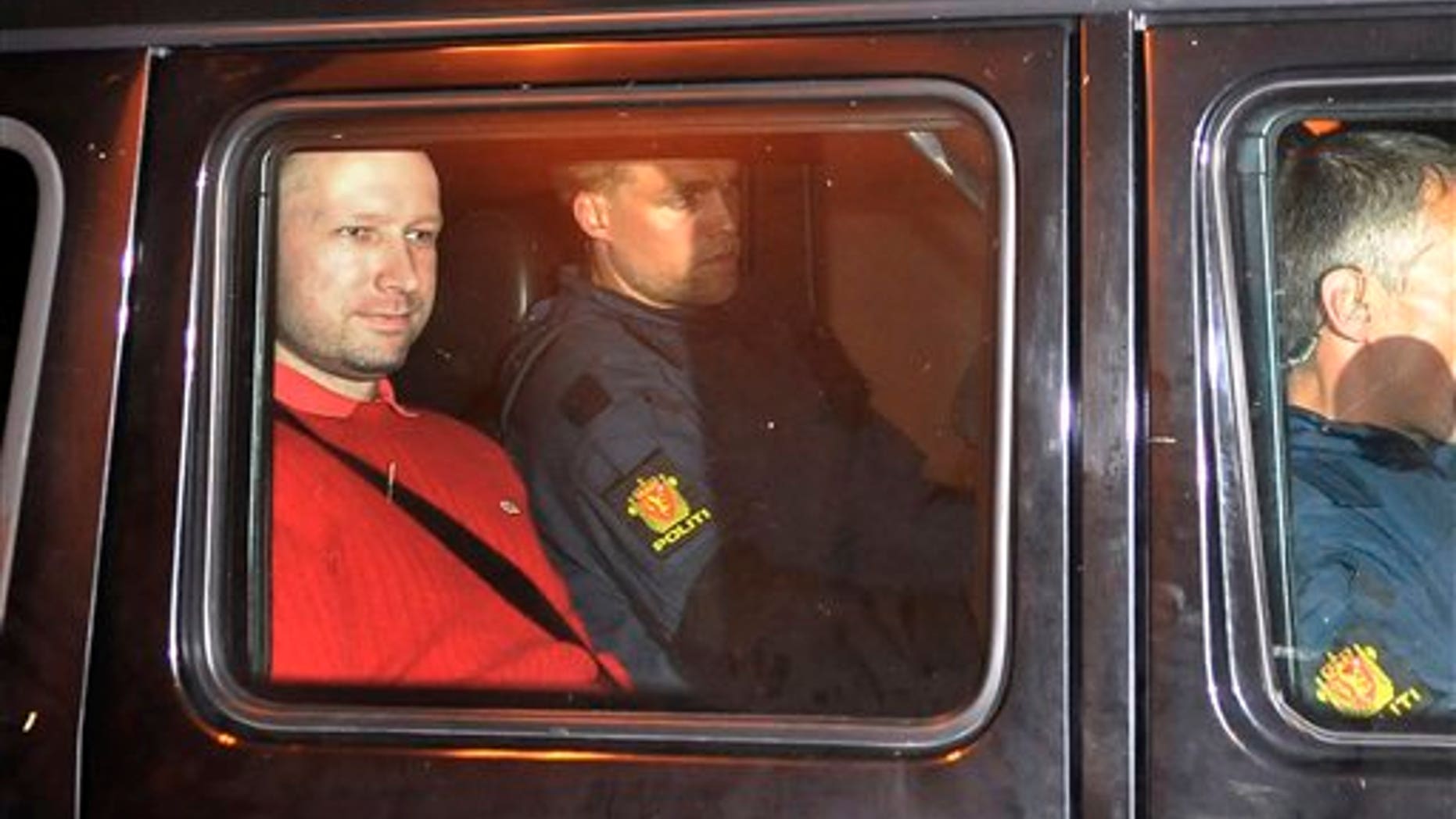 July 25, 2011: Norway's twin terror attacks suspect Anders Behring Breivik, left, sits in an armored police vehicle after leaving the courthouse following a hearing in Oslo, Norway where he pleaded not guilty to one of the deadliest modern mass killings in peacetime. (AP Photo/Aftenposten/Jon-Are Berg-Jacobsen)