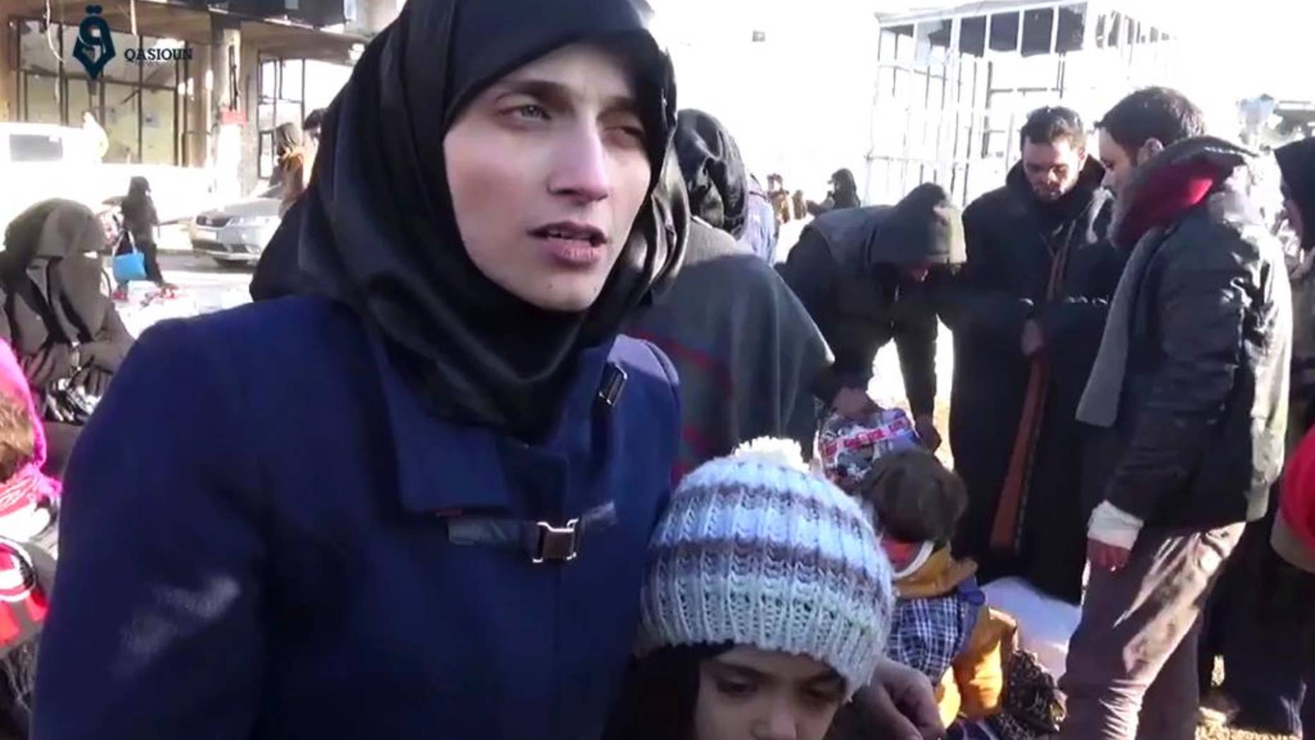 This image made from video released by Qasioun News Agency, a media opposition platform with reporters inside Syria, shows Fatemah Alabed, with her 7-year-old daughter Bana, speaking after they reached the Aleppo countryside following the evacuation of their city, Syria.
