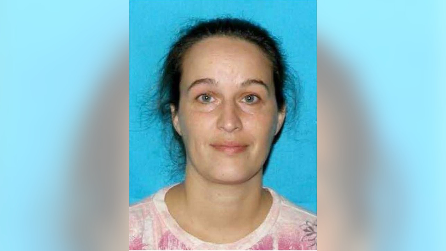 In this undated photo released by the Catoosa County (Ga.) Sheriff's Department, Catherine Goins poses for a photo. Goins, 37, of Hixson, Tenn., is charged with murder after authorities say she gunned down a northwest Georgia woman because she wanted the mother's newborn baby. (AP Photo/Catoosa County (Ga.) Sheriff's Department)