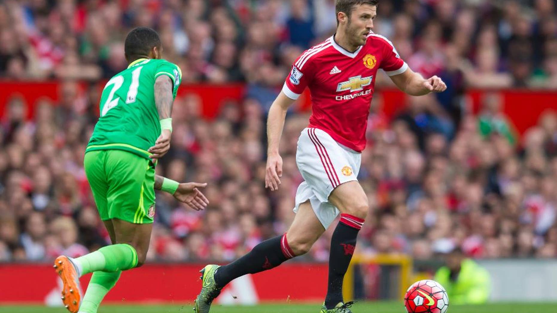 FILE - This is a Saturday, Sept. 26, 2015 file photo of Manchester United's Michael Carrick, right, as he fights for the ball against Sunderland's Yann M'Vila during the English Premier League soccer match between Manchester United and Sunderland at Old Trafford Stadium, Manchester, England. Amid the likely rotation during the 2016 busy festive program in the Premier League, there’s one player Manchester United fans won’t want to see out of the team and that player is Michael Carrick (AP Photo/Jon Super, File)