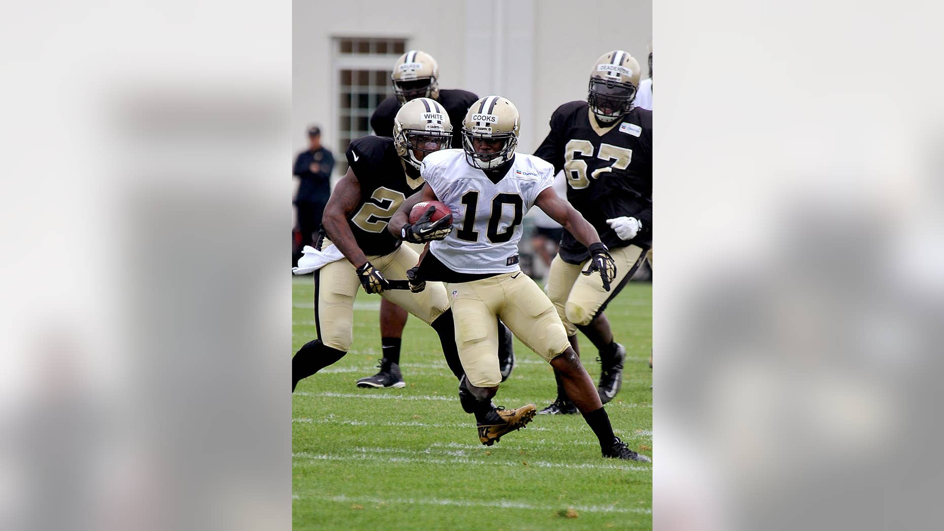 New Orleans Saints wide receiver Brandin Cooks (10) runs the ball during their NFL football training camp in White Sulphur Springs, W.Va., Saturday, Aug. 2, 2014. (AP Photo/Chris Tilley)