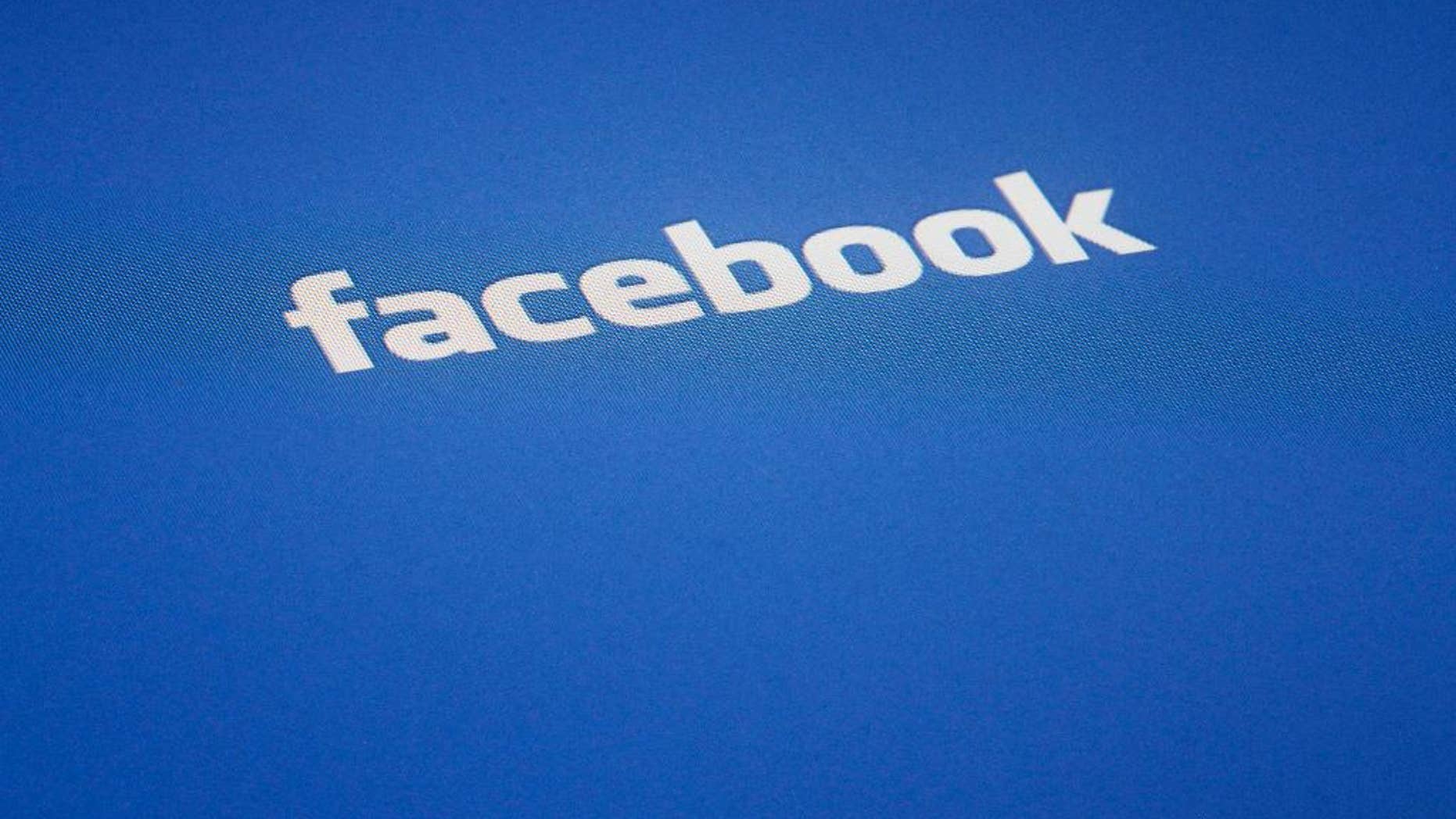 FILE - A Facebook log is displayed on the screen of an iPad, in this Wednesday, May 16, 2012 file photo taken in New York. Facebook, Microsoft, Twitter and YouTube announced a major shared effort Dec. 5, 2016, to more quickly identify the worst terrorist propaganda and prevent it from spreading online. The new program would create a database of unique digital “fingerprints” to help automatically identify videos or images the companies could remove. (AP Photo/James H. Collins, file)