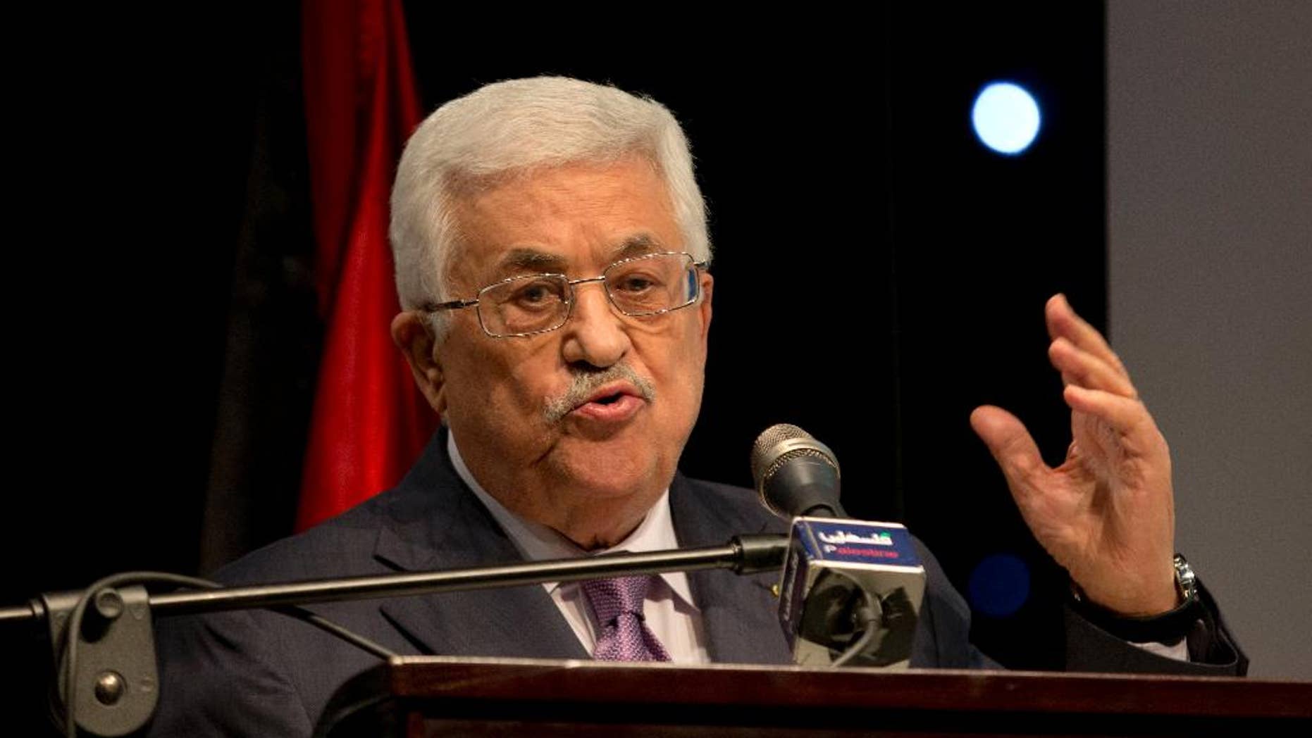Palestinian President Mahmoud Abbas speaks during a ceremony of "Jerusalem In Memory"?? after the meeting with Secretary General of The Organization of The Islamic Conference Iyad Amin Madani, in the West Bank city of Ramallah, Sunday, Jan. 4, 2015. (AP Photo/Majdi Mohammed)