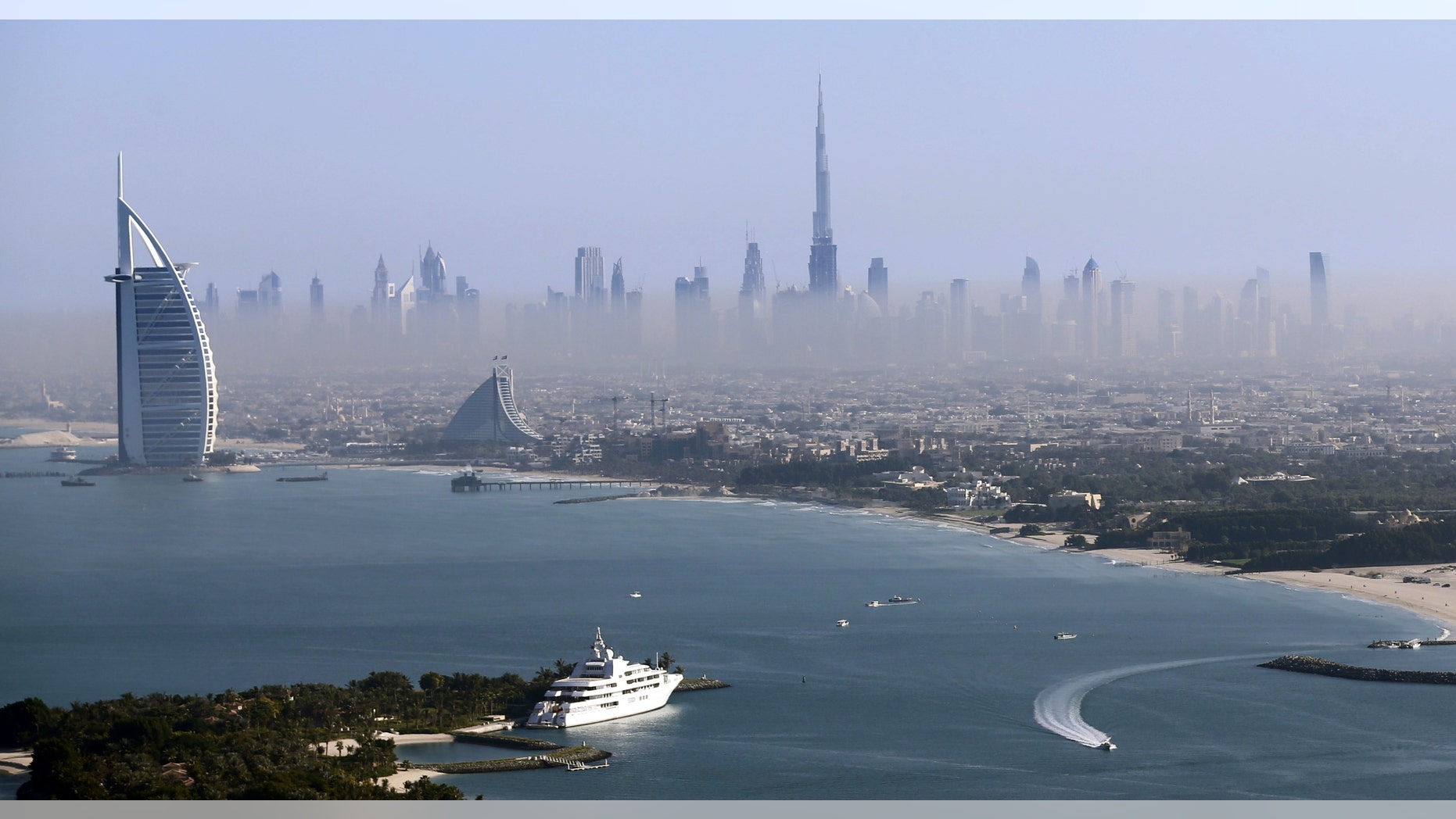 File photo - Burj Khalifa, the world's tallest tower, and luxury Burj al-Arab Hotel (L) are seen in a general view of Dubai, UAE December 9, 2015. (REUTERS/Karim Sahib/Pool)