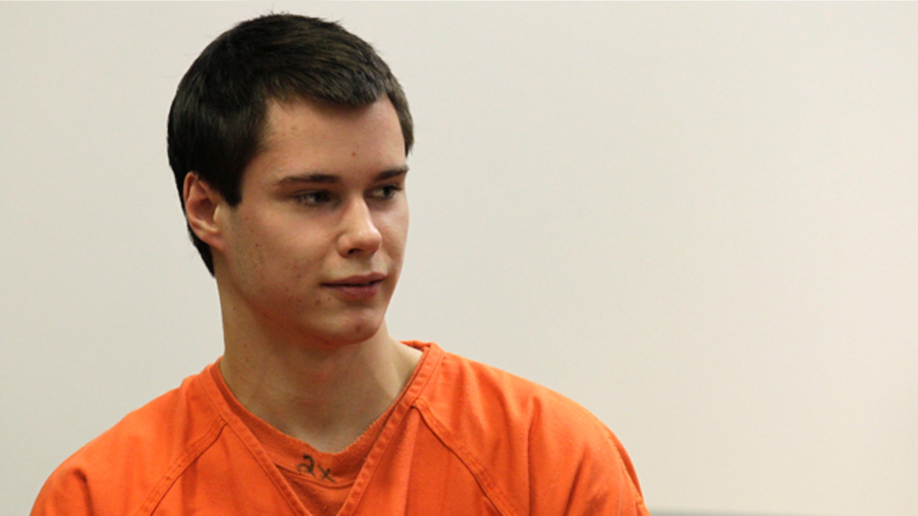 Dec. 16: Colton Harris-Moore, also known as the 'Barefoot Bandit' glances at the courtroom gallery as he walks to the defense table, in Island County Superior Court, in Coupeville, Wash.