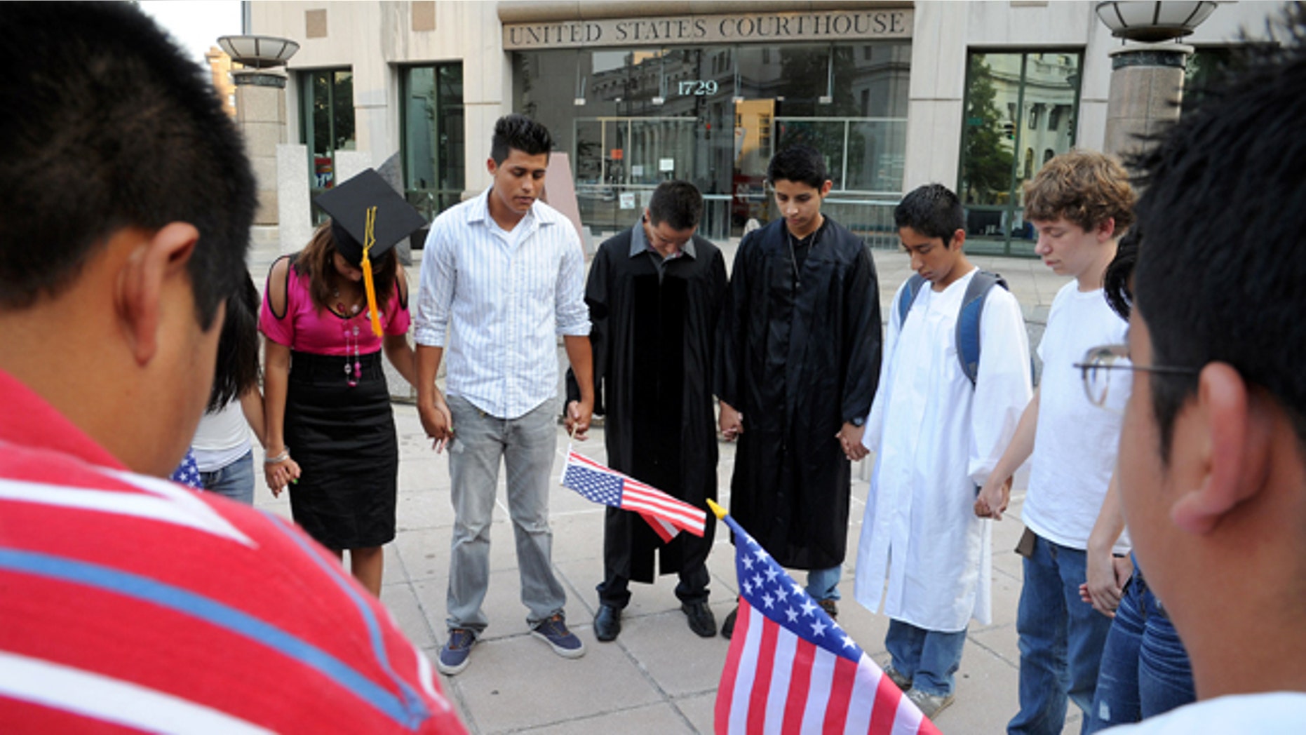 Aug. 24: Hispanic protestors pray outside the federal courthouse during an all-day hearing over efforts to persuade a federal judge to block Alabama's immigration law in Birmingham, Ala. On Aug. 29 A federal judge temporarily blocked enforcement of Alabama's new law cracking down on illegal immigration.