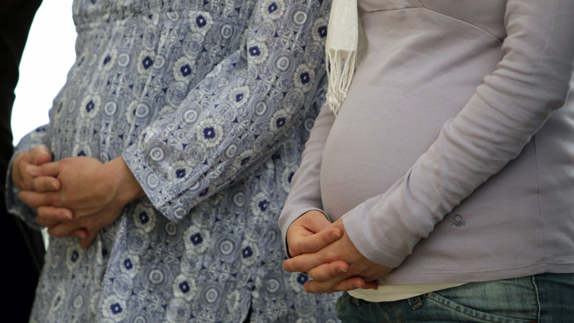 MUNICH, GERMANY - MAY 13: Pregnant women pray during a holy ecumenical mass at the second day of the 2nd ecumenical Kirchentag on May 13, 2010 in Munich, Germany. (Photo by Alexandra Beier/Getty Images)