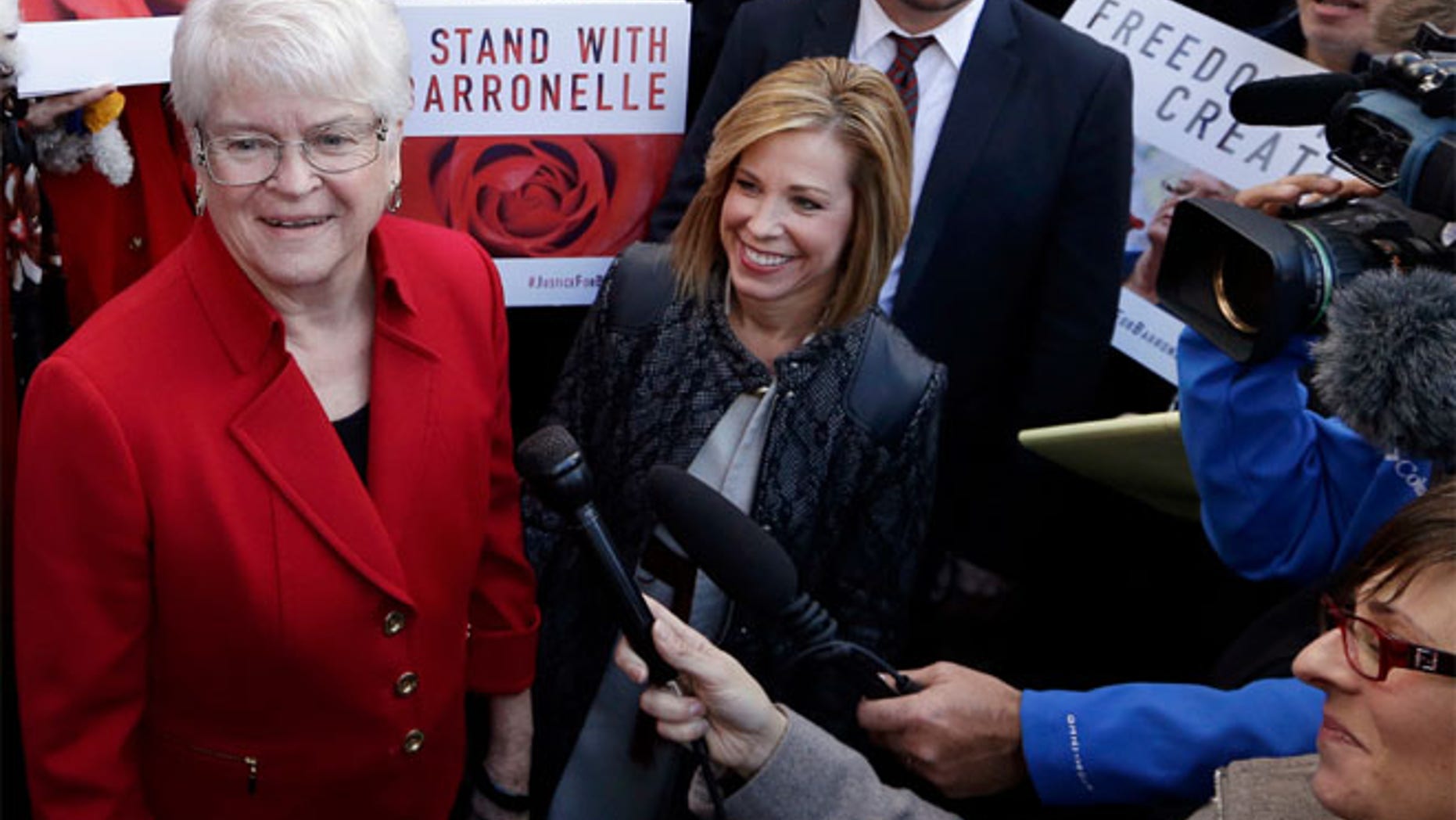 FILE: Barronelle Stutzman, left, was fined for denying service to a gay couple in 2013.