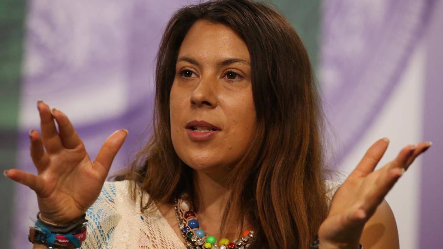 2013 Wimbledon champion Marion Bartoli of France attends a press conference at the All England Lawn Tennis Championships in Wimbledon, London, Sunday June 22, 2014. The Championships start Monday June 23. (AP Photo/AELTC, Scott Heavey)