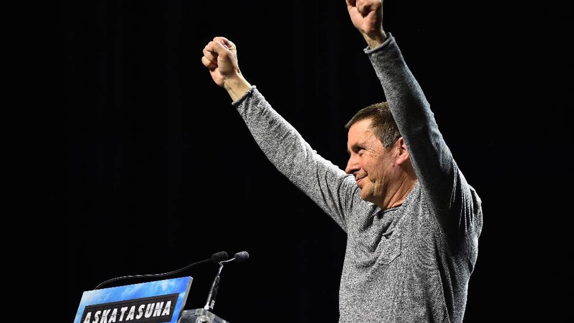 FILE - A Saturday, March 5, 2016 file photo of Arnaldo Otegi, a prominent Basque separatist politician, gesturing as he receives a tribute during a political meeting, in San Sebastian, northern Spain. Basque authorities say the prominent regional leader who was jailed for his links with the outlawed armed group ETA can´t stand as candidate in upcoming elections because his sentence bans him from holding office until 2021.(AP Photo/Alvaro Barrientos, File)