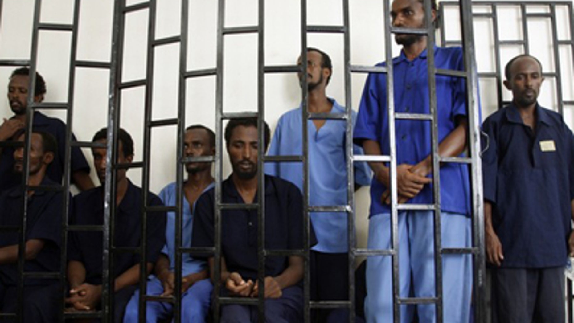 July 15, 2009: Suspected Somali pirates appear behind bars of a court in Yemen's southern port city of Aden. Worldwide piracy figures have reached a five-year low, according to the International Maritime Bureau. (Reuters)