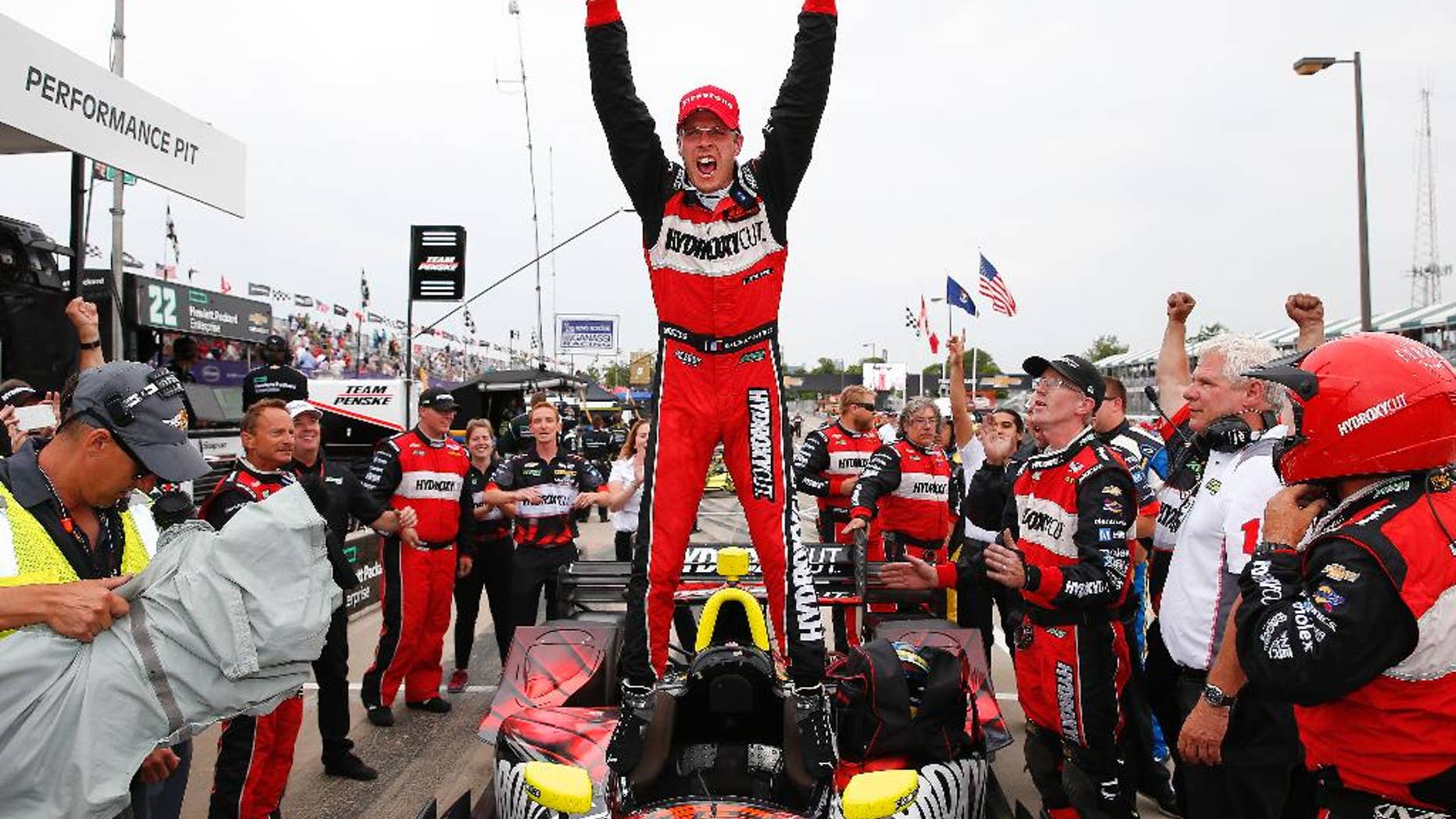 FILE - In this June 4, 2016 file photo, Sebastien Bourdais, of France, celebrates winning race one of the IndyCar Detroit Grand Prix auto racing double header on Belle Isle in Detroit. Bourdais speaks reverently about the Le Mans 24 Race in his native France, as if some mythical force has a hand in the competition. “I don’t know what’s the criteria ... All I can tell you is Le Mans picks its winner,” Bourdais said. If that’s the case, this year, the race finally picked him. (AP Photo/Paul Sancya, File)
