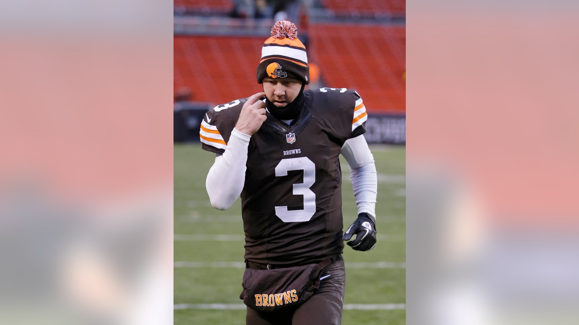 Cleveland Browns quarterback Brandon Weeden jogs off the field after a 27-11 loss to the Pittsburgh Steelers in an NFL football game on Sunday, Nov. 24, 2013, in Cleveland. (AP Photo/Tony Dejak)