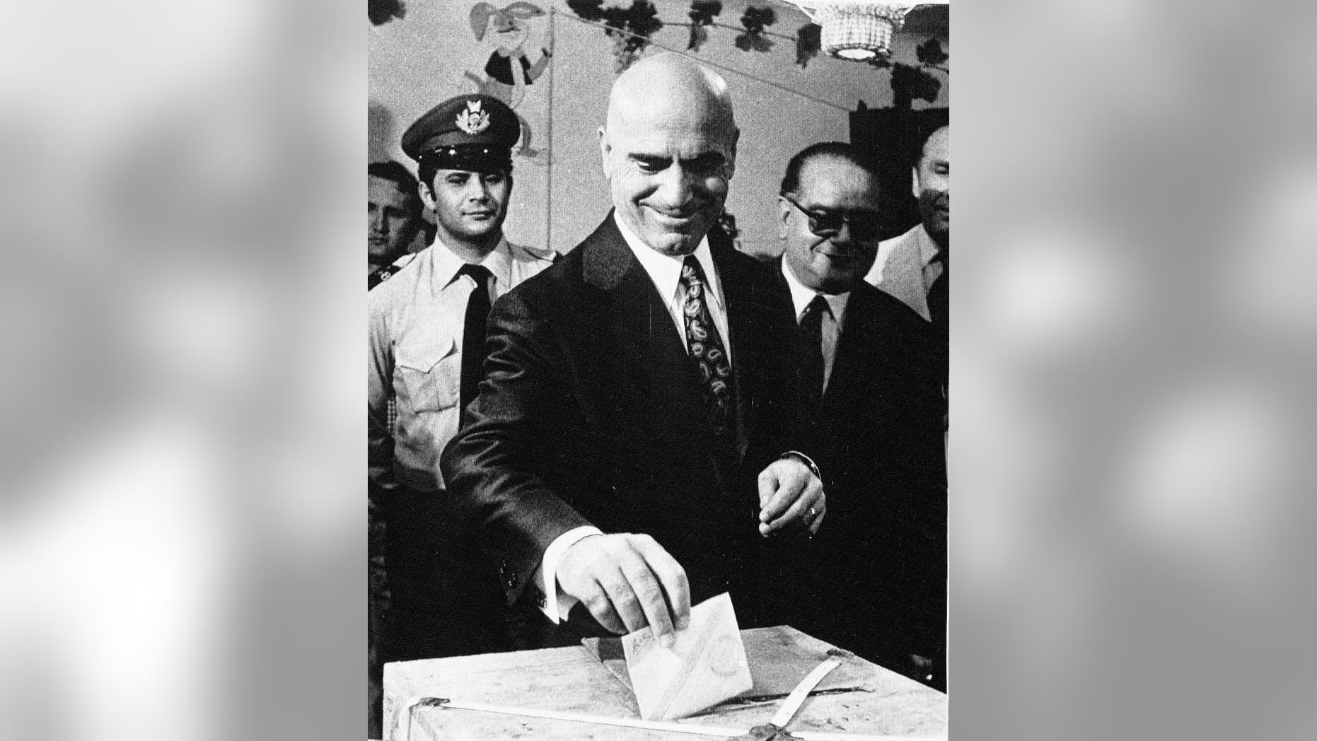 FILE - In this July 29, 1973 file photo, Deputy Premier Stylianos Pattakos casts his ballot in a referendum in Athens. Pattakos, the last survivor among the leaders of a 1967 coup that ruled Greece for seven years, has died at 103. The state-run Athens News Agency reported that he died following a stroke on Saturday. (AP Photo/Aristotle Saris, File)