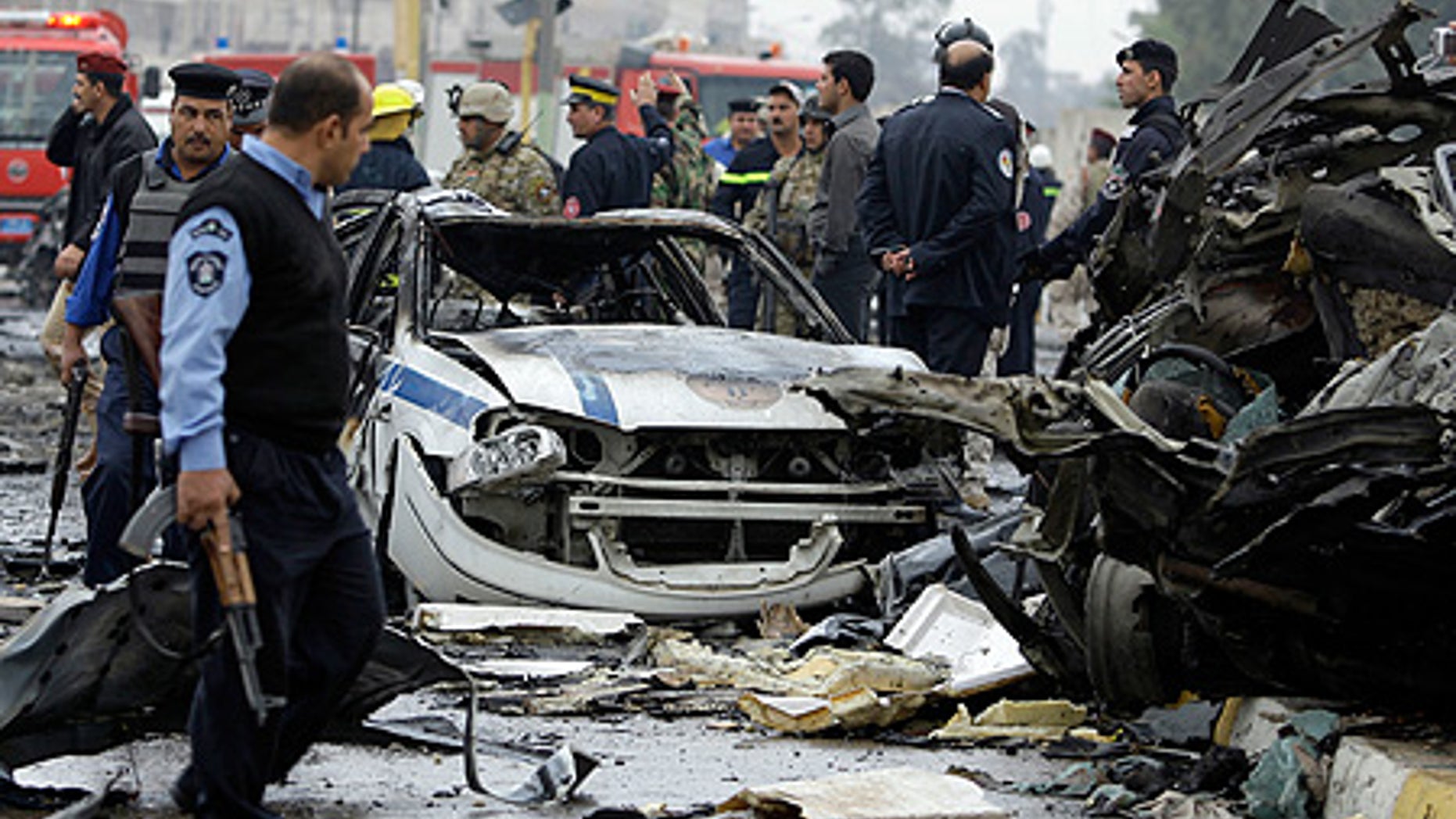 Dec. 8: Iraqi security forces gather at the site of a bomb attack near the Labor Ministry building in Baghdad.