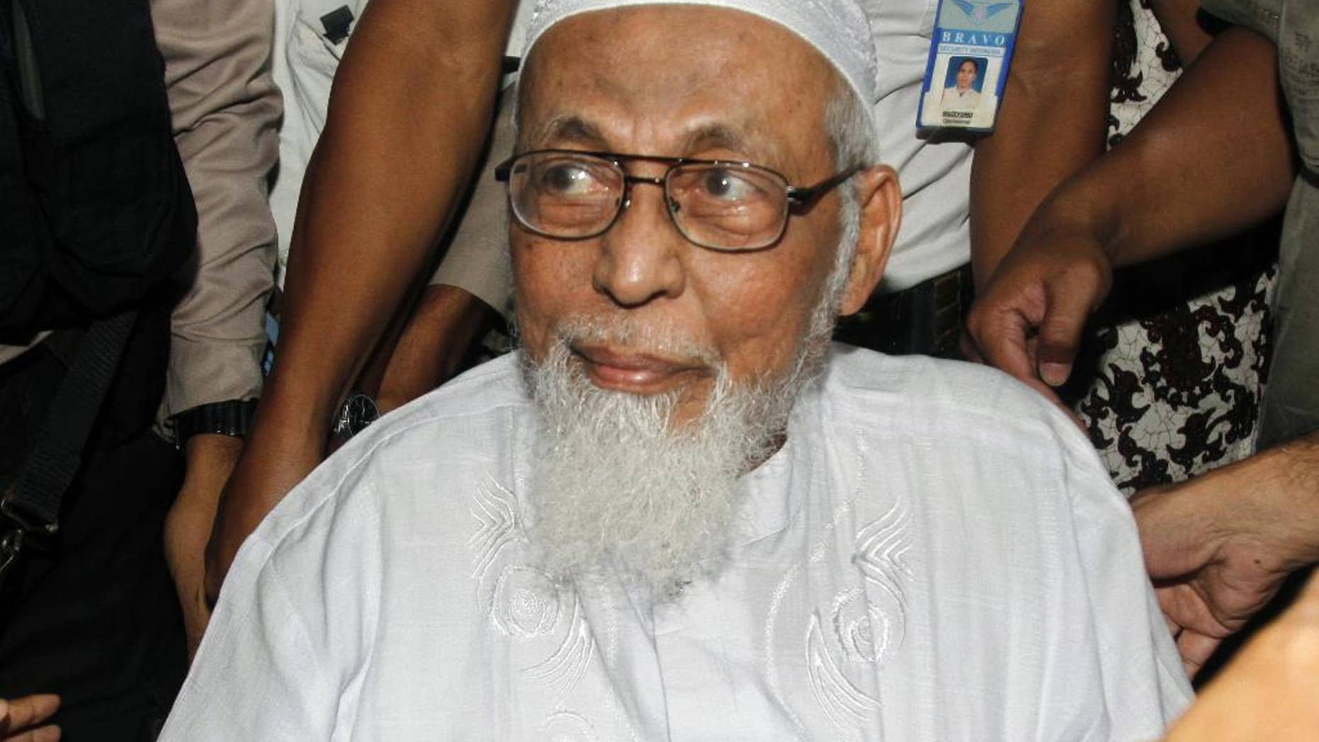 FILE - In this Wednesday, Feb. 29, 2012 file photo, Indonesian militant cleric Abu Bakar Bashir arrives at a hospital to undergo medical treatment, in Jakarta, Indonesia. A lawyer for the spiritual leader of the militants who carried out the 2002 Bali bombings urges Indonesian authorities to end his “inhumane” treatment in prison, saying that Bashir has been confined to a tiny isolation cell in the wake of the Jan. 14 suicide bombings in the Indonesian capital Jakarta. (AP Photo/Tatan Syuflana, File)