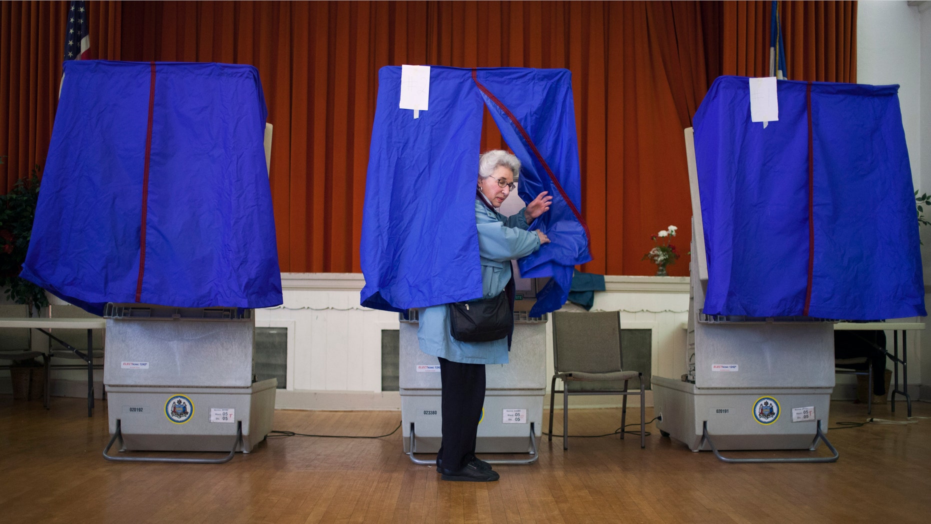 PHILADELPHIA, PA - APRIL 24: Lilyan Maitan stands in a voting booth during the Republican primary election April 24, 2012 at St. George Greek Orthodox Church in Philadelphia, Pennsylvania. Turnout is expected to be low as Former Massachusetts Gov. Mitt Romney continues his campaign as the presumptive GOP candidate. (Photo by Jessica Kourkounis/Getty Images)