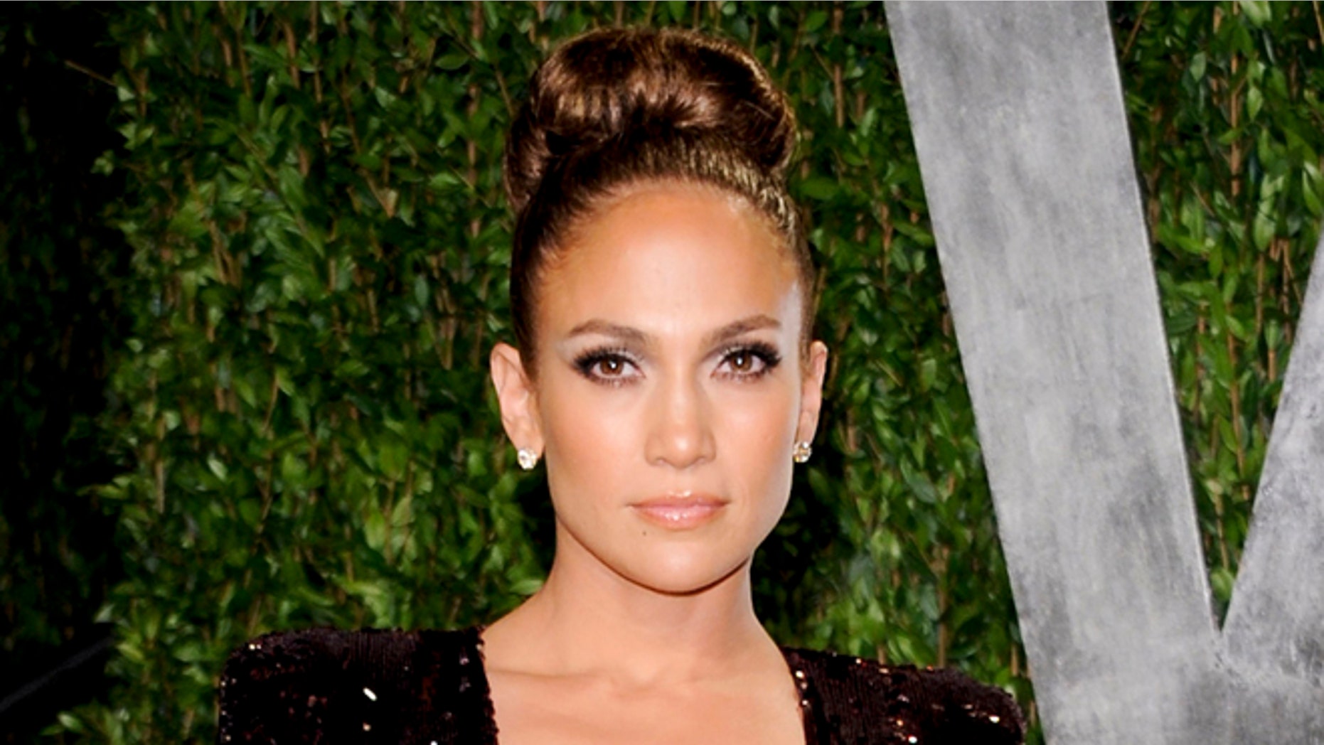 FILE - In this Feb. 26, 2012 file photo, actress and singer Jennifer Lopez arrives at the Vanity Fair Oscar party in West Hollywood, Calif. ABC Family announced Thursday, Aug. 23, 2012 that it has greenlighted a pilot titled The Fosters, from Jennifer Lopez's production company about a diverse family headed by a lesbian couple. (AP Photo/Evan Agostini, file)