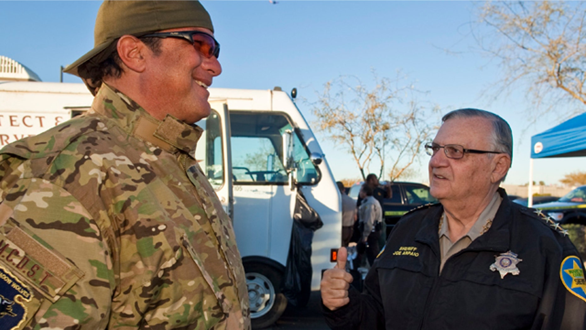 Maricopa County Sheriff Joe Arpaio, right, talks with actor Steven Seagal, who was visiting the sheriff.