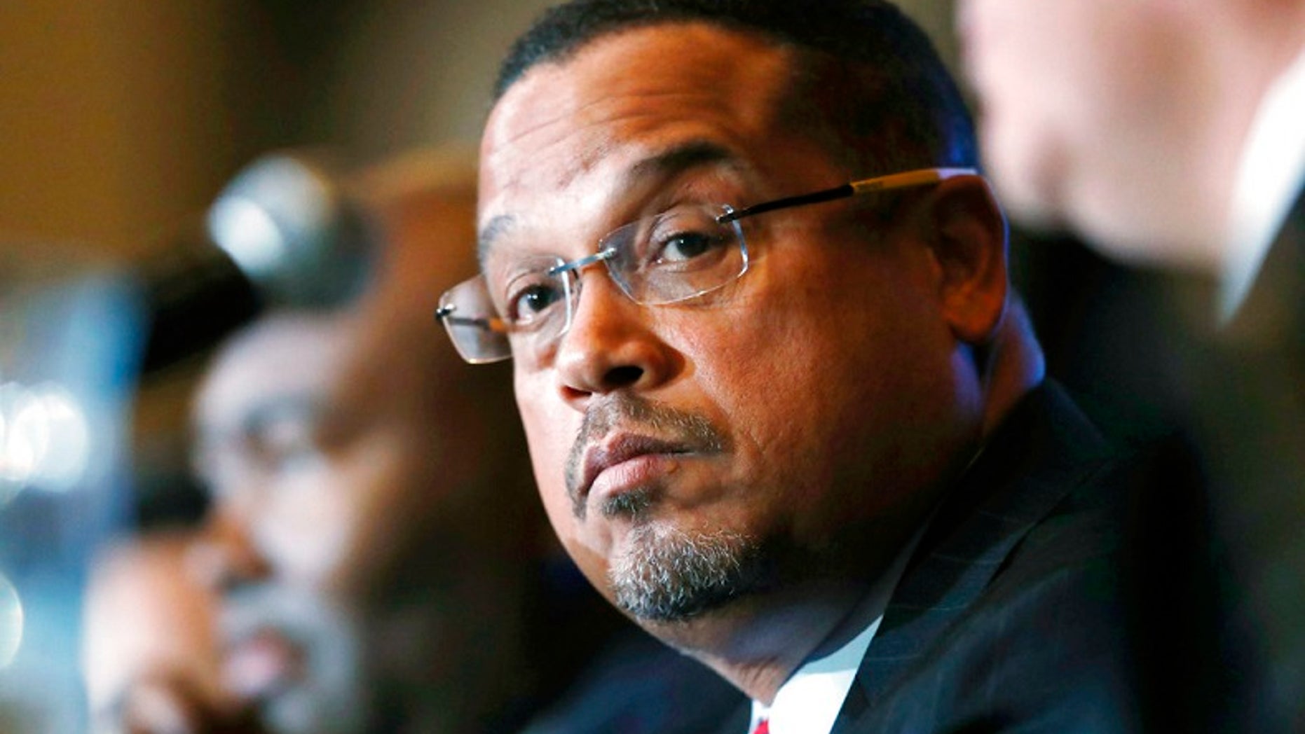 FILE - In this Dec. 2, 2016, file photo, U.S. Rep. Keith Ellison, D-Minn., listens during a forum on the future of the Democratic Party, in Denver. On Sunday, Aug. 12, 2018, Ellison denied an allegation from an ex-girlfriend that he had once dragged her off a bed while screaming obscenities at her. The allegation came just days before a Tuesday primary in which the Democrat is among several running for state attorney general. (AP Photo/David Zalubowski, File)