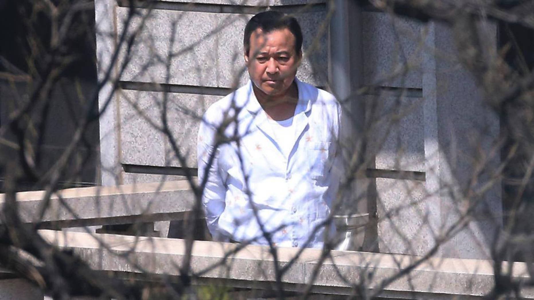 South Korean Prime Minister Lee Wan Koo walks on the terrace of his residence in Seoul, South Korea, Tuesday, April 21, 2015. Lee has offered to resign amid a bribery scandal just two months after he took up the country's No. 2 post, officials said Tuesday, in the latest political crisis to hit President Park Geun-hye. (Kim Bong-kyu/The Hankyoreh via AP) KOREA OUT
