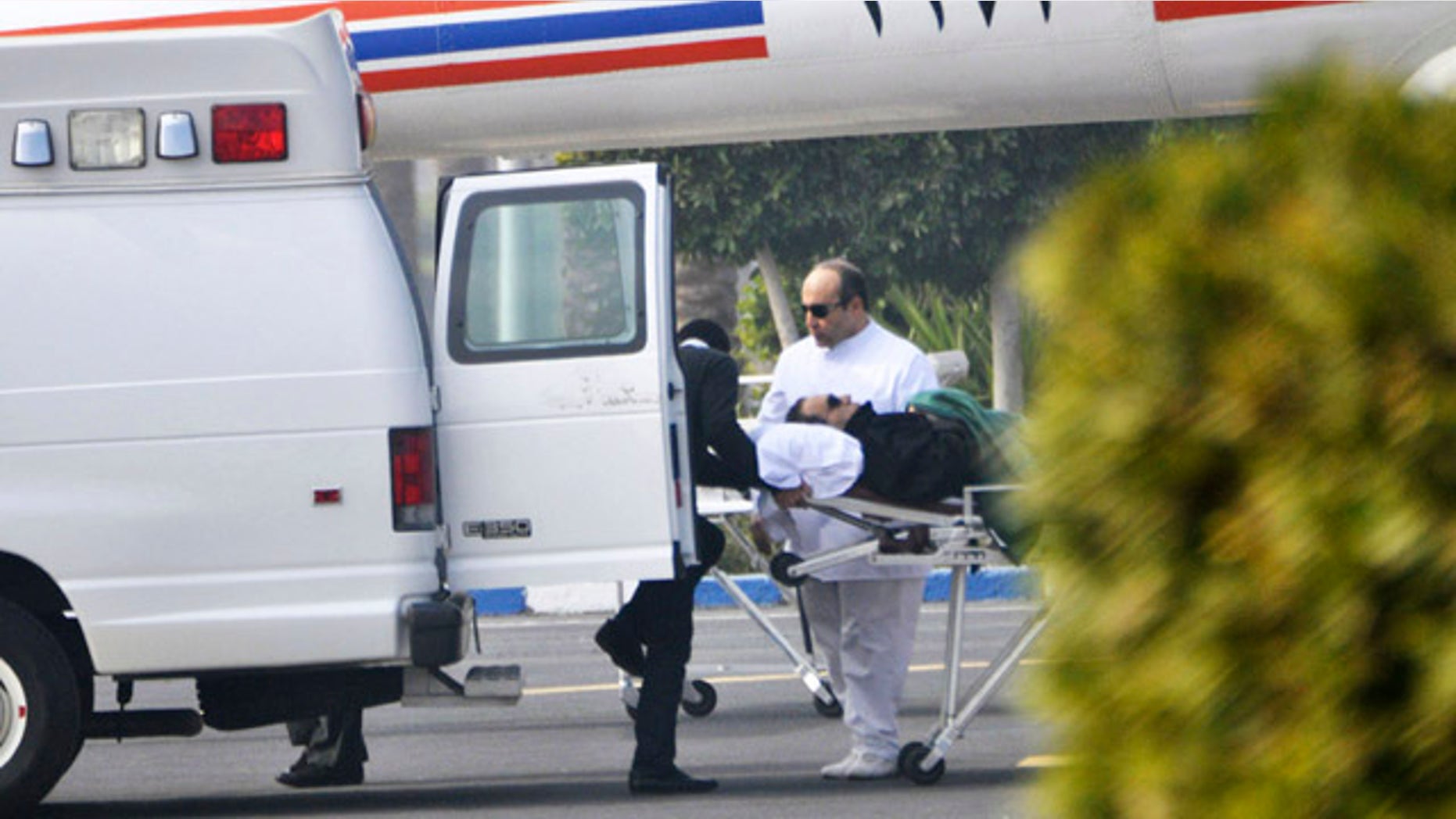 Jan. 4, 2012: Former Egyptian president Hosni Mubarak is wheeled into a van after attending a trial in Cairo, Egypt.
