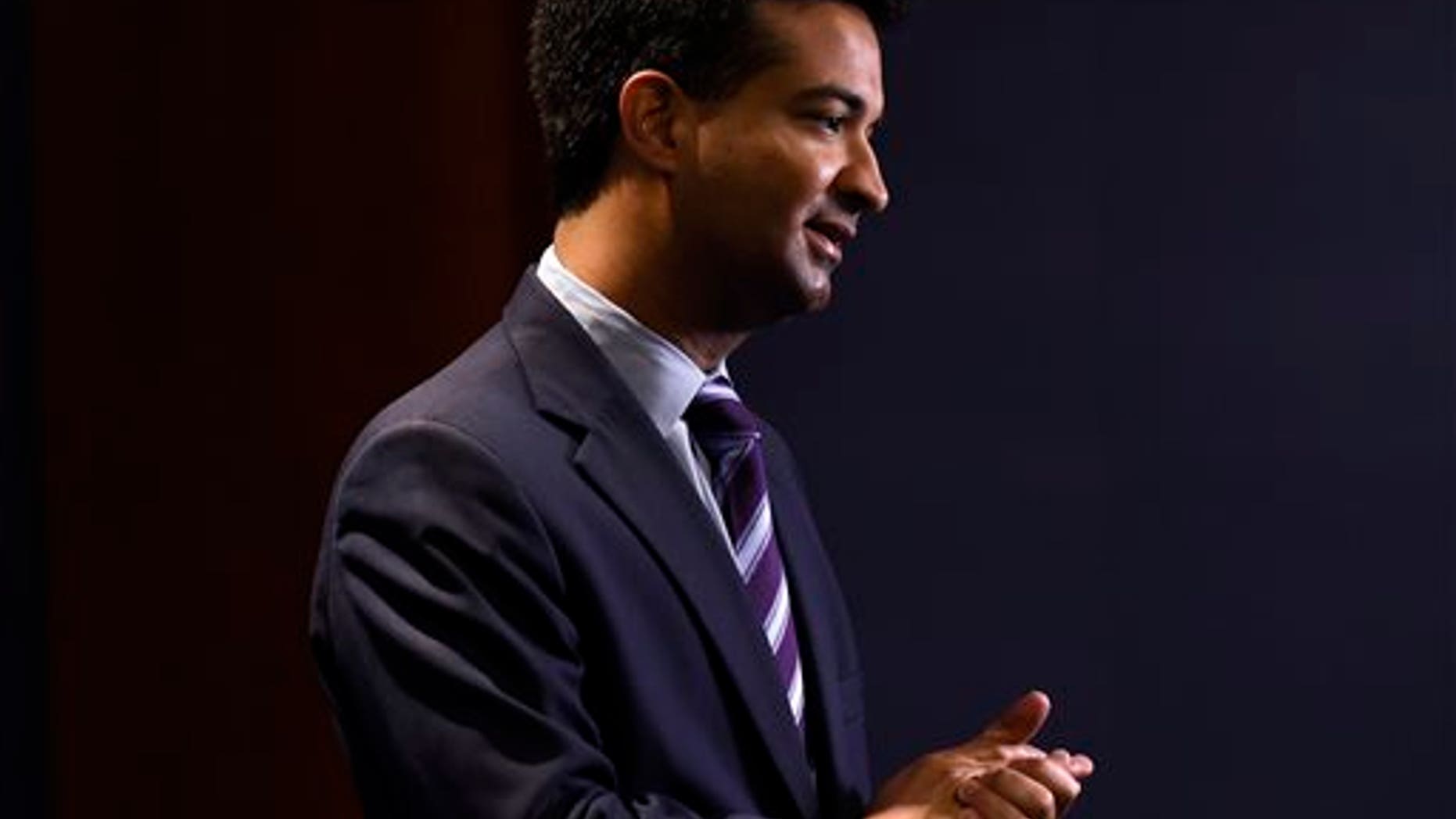 FILE - In this Nov. 13, 2014 fil photo, Rep.-elect Carlos Curbelo, R-Fla., does a television interview on Capitol Hill in Washington. (AP Photo/Susan Walsh, File)