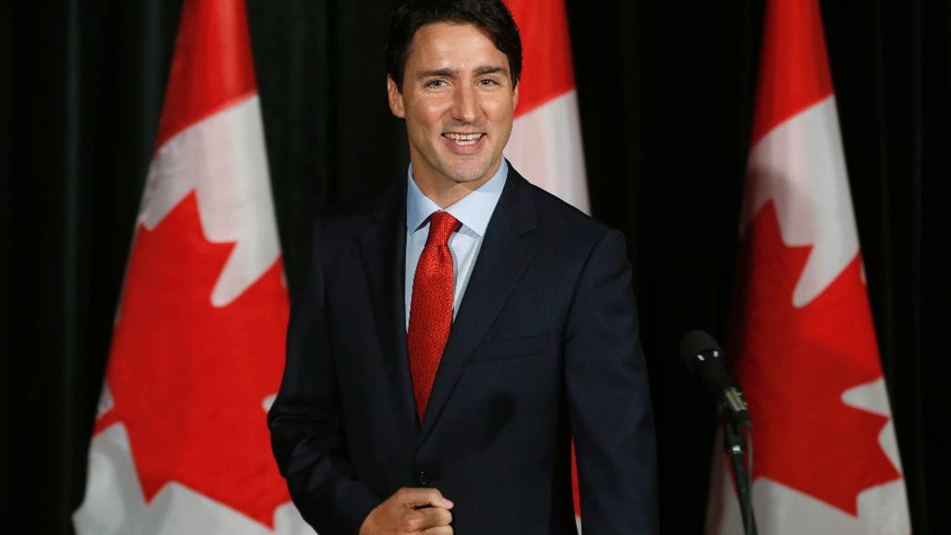 Canadian Prime Minister Justin Trudeau greets the press before going into the Liberal cabinet retreat in Calgary, Alberta, Monday, Jan. 23, 2017. (Todd Korol/The Canadian Press via AP)