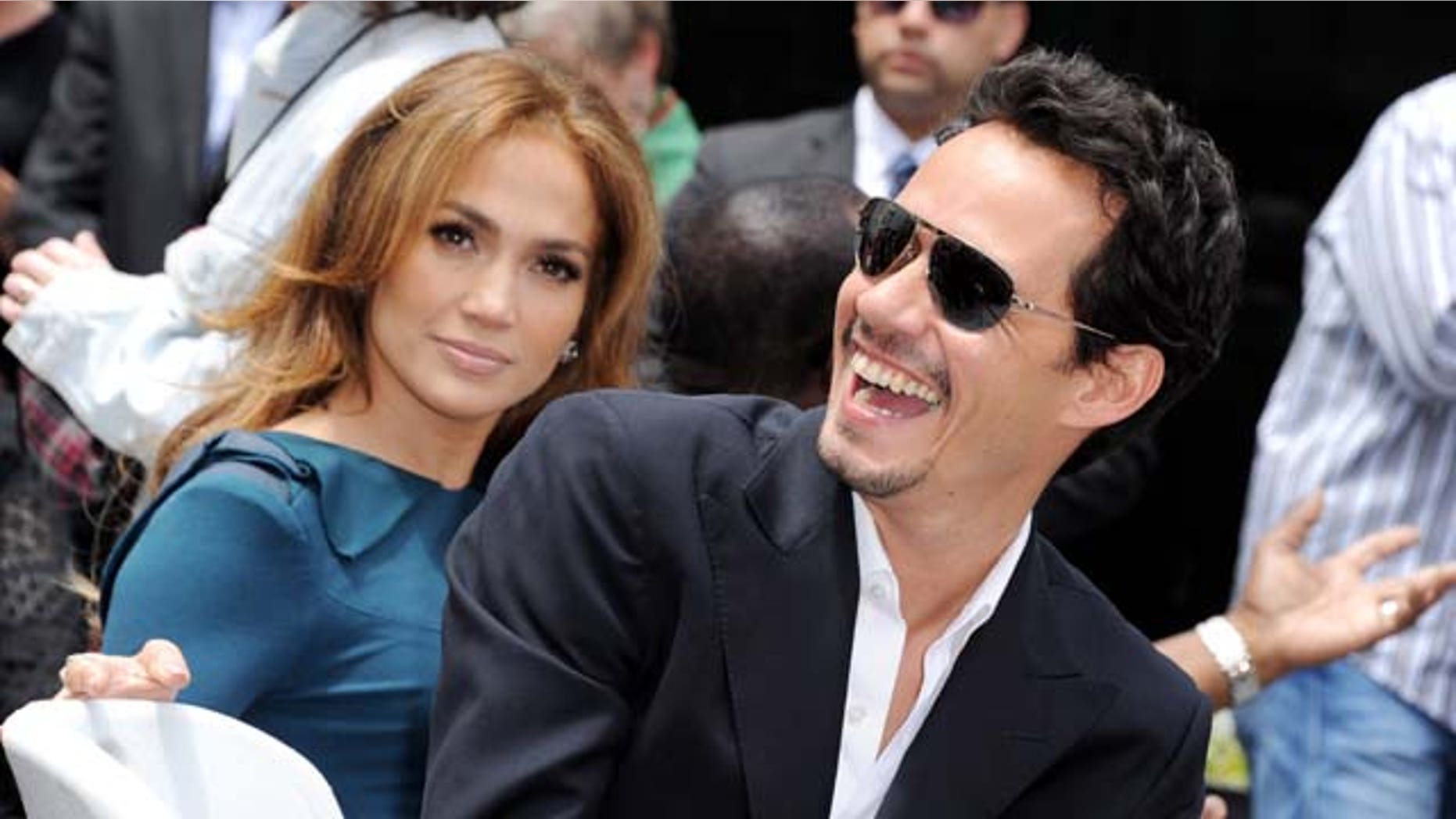 MAY 23, 2011: Jennifer Lopez and her husband singer Mark Anthony pose at Simon Fuller's Hollywood Walk of Fame star presentation ceremony at Hollywood & Vine in Los Angeles, Calif.