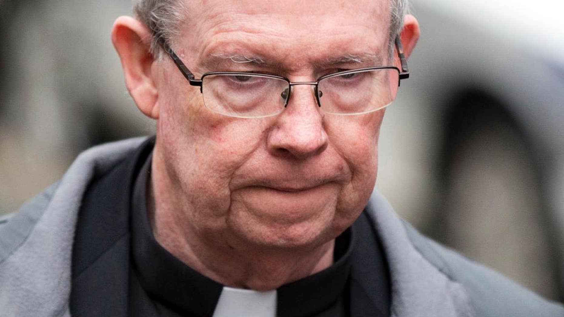 FILE - In this Jan. 6, 2014, file photo, Monsignor William Lynn walks from the criminal justice center after a bail hearing in Philadelphia. The Pennsylvania Supreme Court ruling Monday, April 27, 2015, upholds the 2012 conviction of Lynn over abuse committed by a diocesan priest years earlier. (AP Photo/Matt Rourke, File)