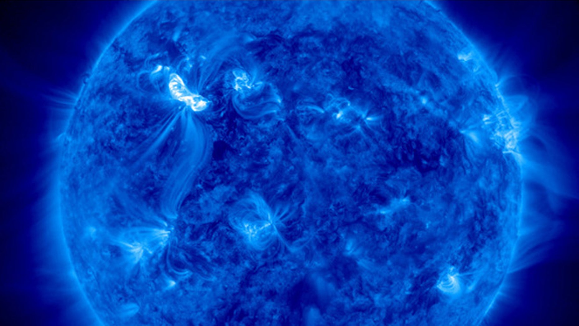March 6, 2012: NASA's Solar Dynamics Observatory captures the sun as it unleashed an X5.4-class solar flare at 7:04 p.m. EST. The flare appears as the bright spot in the upper left.