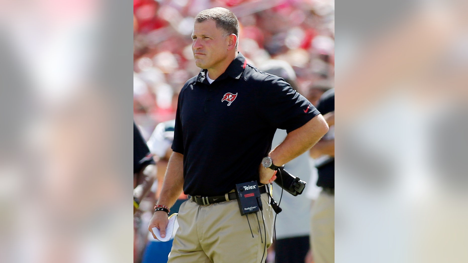 FILE - In this Sept. 29, 2013, file photo, Tampa Bay Buccaneers head coach Greg Schiano watches from the sideline during the second half of an NFL football game against the Arizona Cardinals in Tampa, Fla. Before Schiano became Tampa Bay's head coach, Chip Kelly turned down the Buccaneers. Kelly also turned down the Browns and Eagles a year later before changing his mind and leaving Oregon. When the Buccaneers and Eagles meet Sunday, the two coaches will be on opposite sidelines. (AP Photo/Reinhold Matay, File)