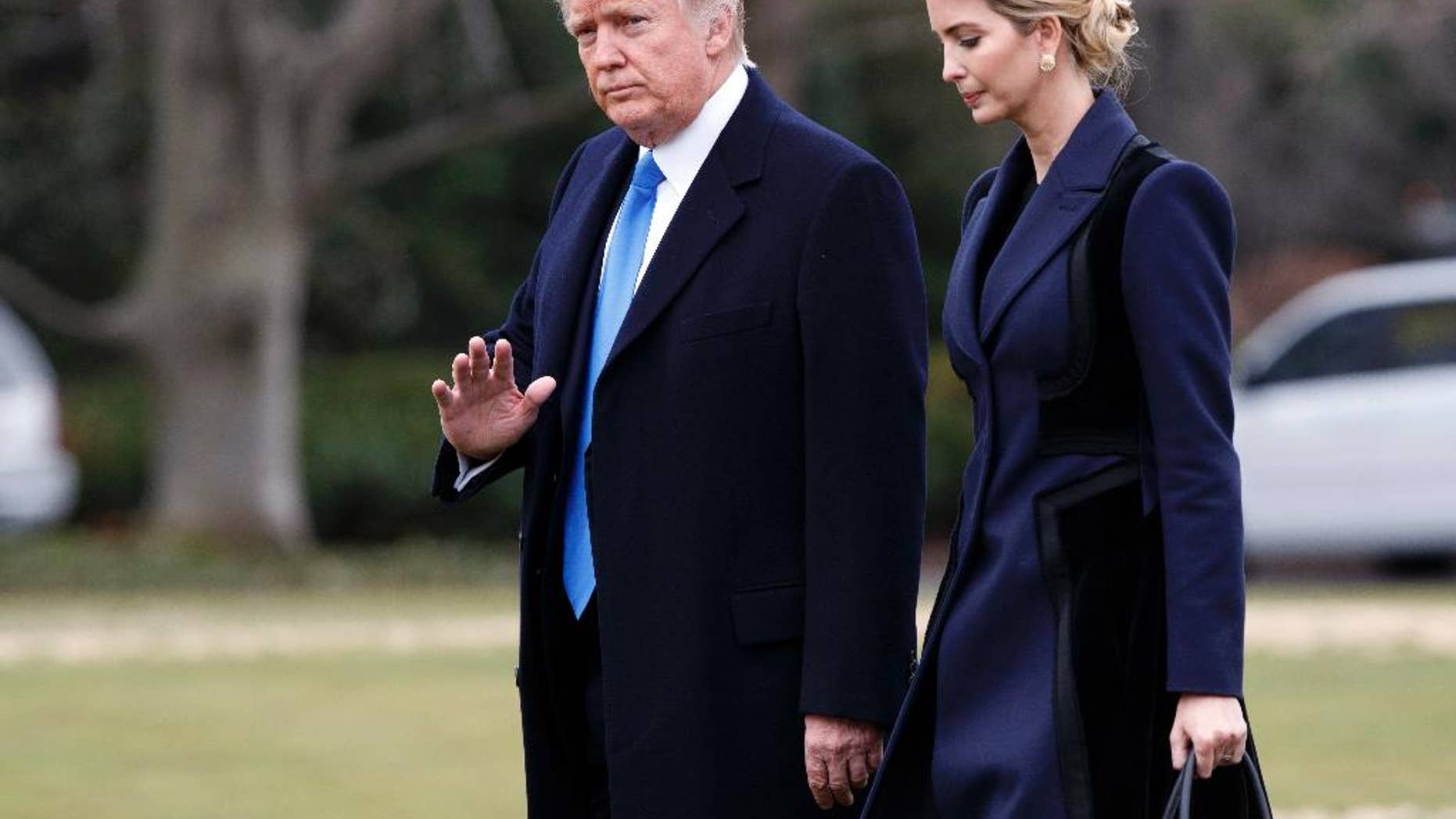 In this Feb. 1, 2017, photo, President Donald Trump, accompanied by his daughter Ivanka, waves as they walk to board Marine One on the South Lawn of the White House in Washington. She may have no official White House title. But Ivanka Trump is already proving that she is an unofficial power player. The first daughter has made clear that she wants to work on policy and support her father. (AP Photo/Evan Vucci)