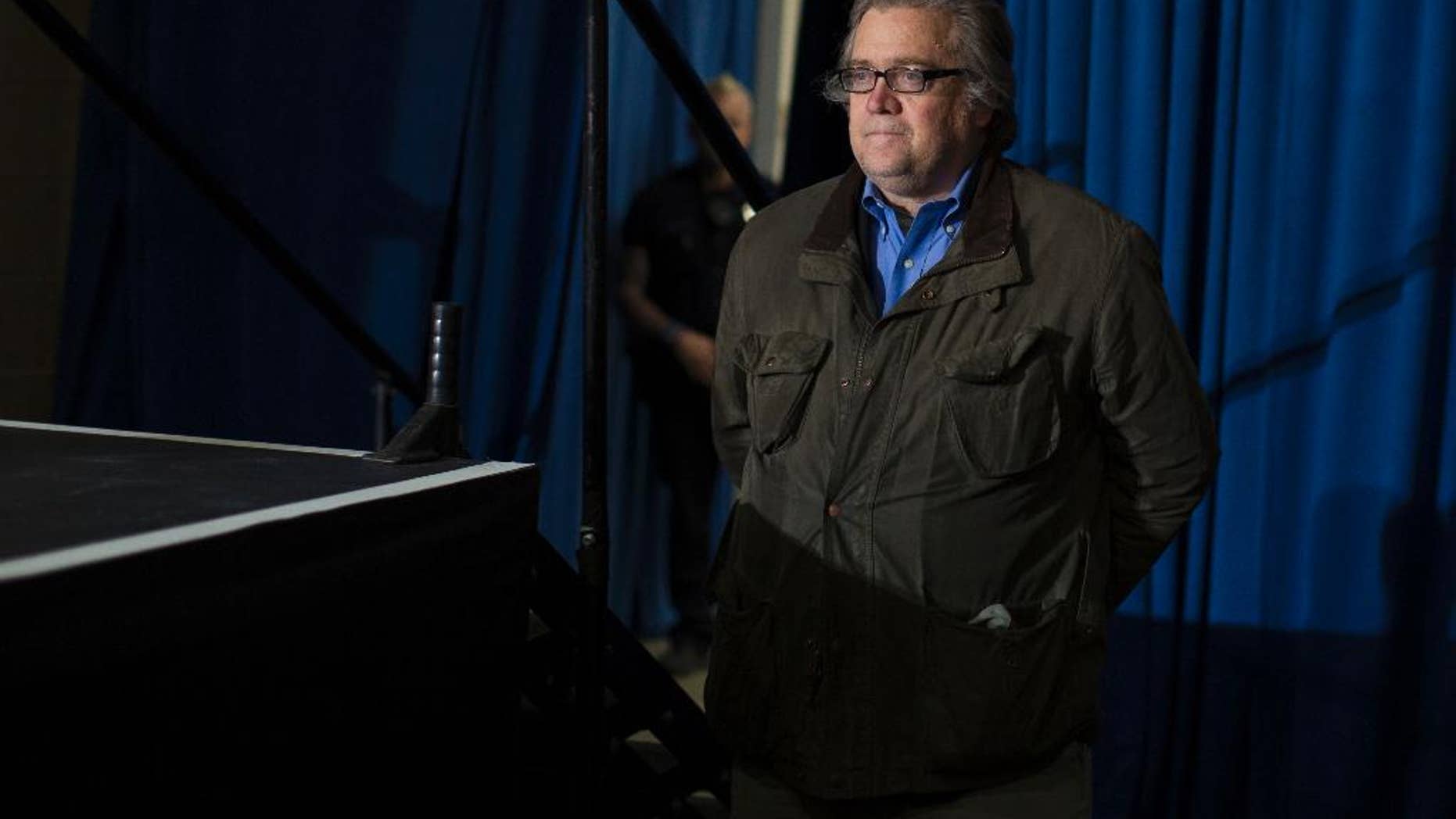 FILE - In this Saturday, Nov. 5, 2016, file photo, Stephen Bannon, campaign CEO for Republican presidential candidate Donald Trump, looks on as Trump speaks during a campaign rally in Denver. Following the installation of Breitbart's chief executive, Bannon, to a top job in President-elect Trump's administration, the news organization in its infancy when Barack Obama took office has big expansion plans and the goal of being the best source of news on the new administration. (AP Photo/Evan Vucci, File)