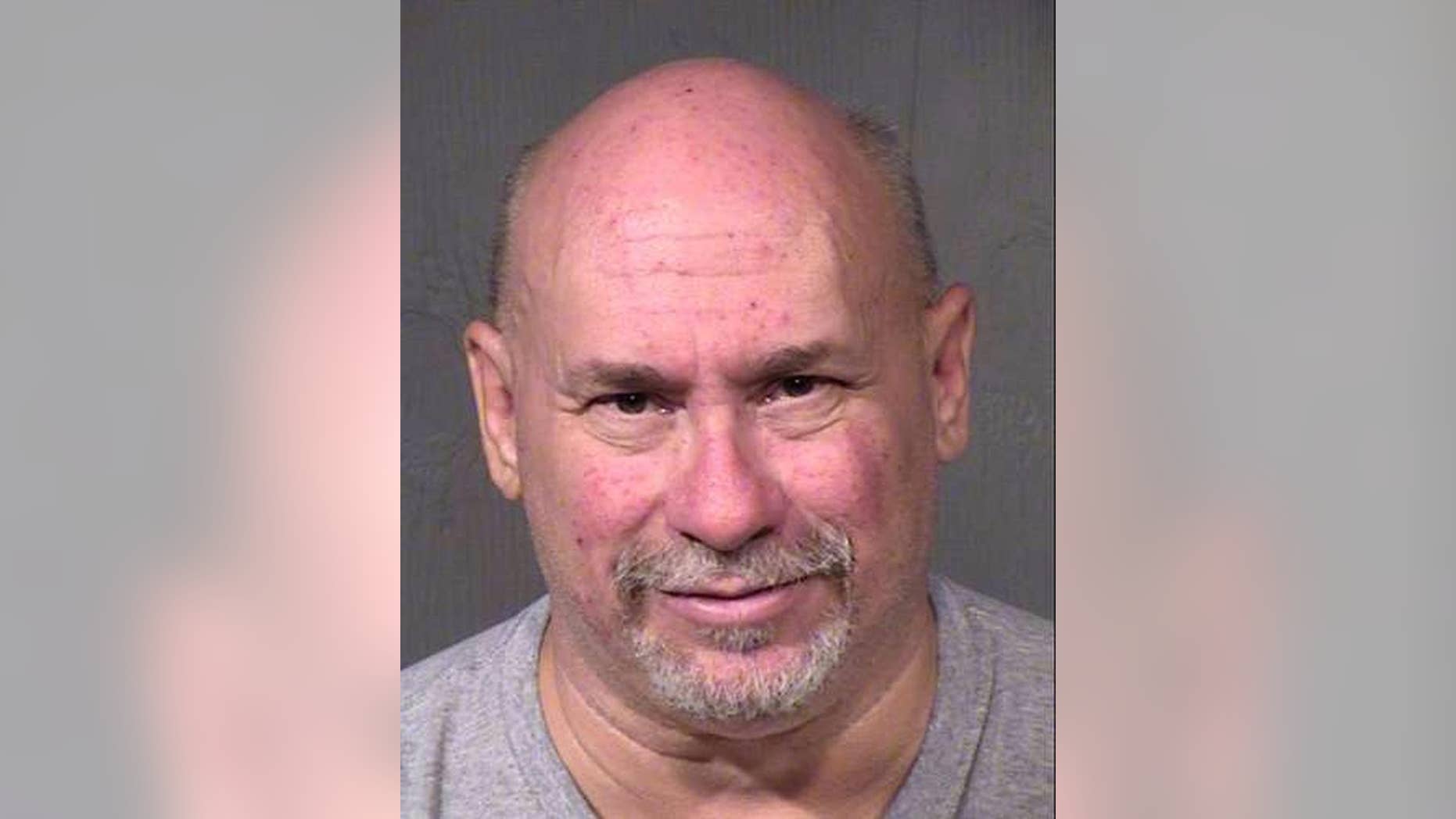 This undated booking photo provided by the Maricopa County Sheriff shows William James Hartwell, who is scheduled to go on trial next week on charges that his pornography-production studio near Phoenix's airport operated as a front for a prostitution ring. Hartwell denies the allegations and accuses the government of criminalizing actions protected by the First Amendment. Prosecutors say Hartwell's actions aren't constitutionally protected. (Maricopa County Sheriff via AP)