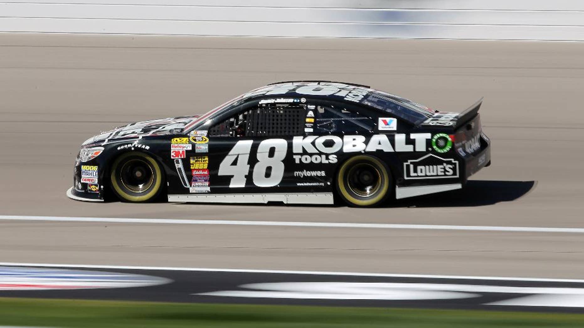 Jimmie Johnson drives during NASCAR Sprint Cup auto racing practice Friday, March 7, 2014, in Las Vegas. (AP Photo/Isaac Brekken)