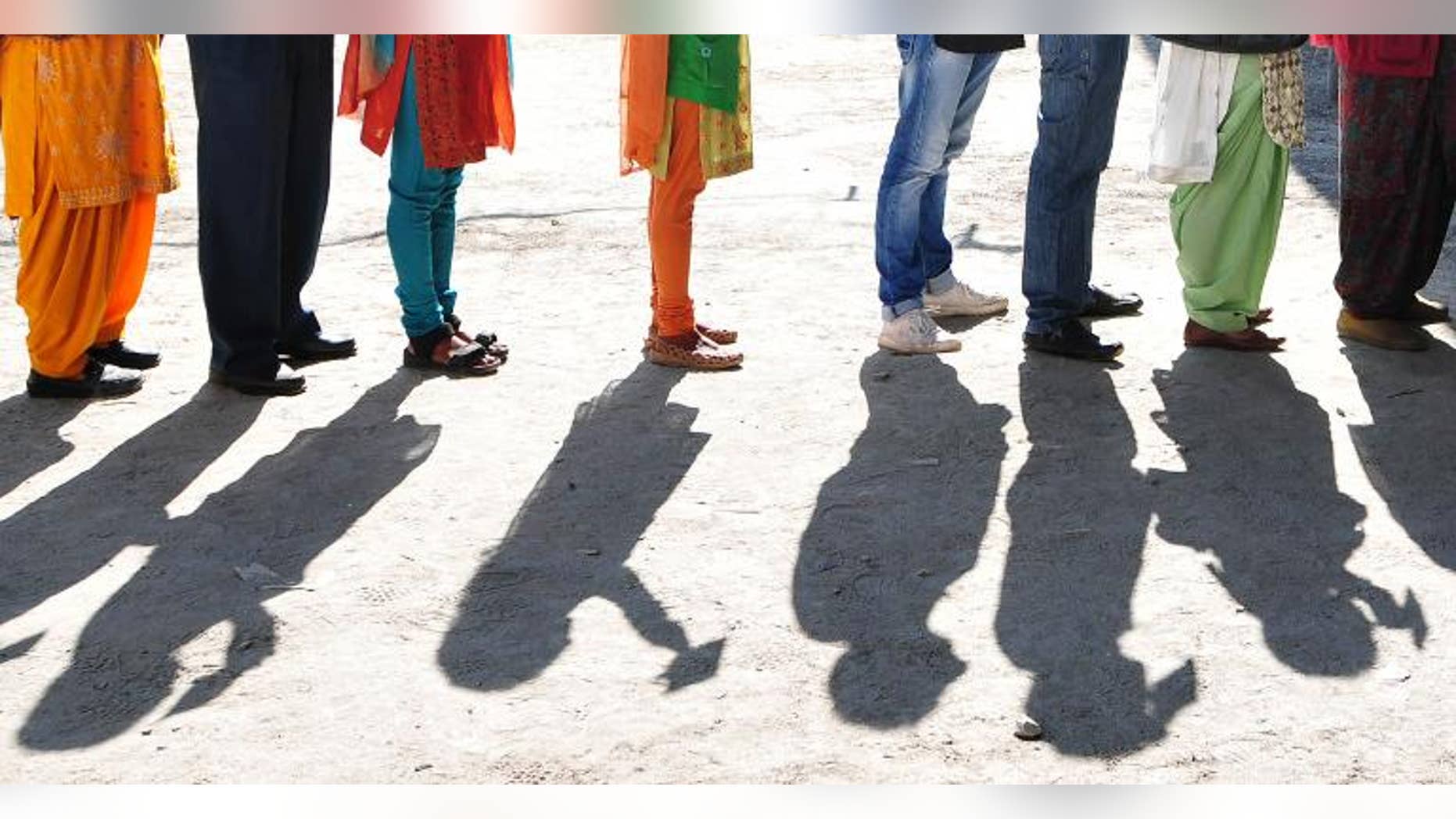 Indian voters wait to vote at a polling station in Devrighat, Himachal Pradesh. India's Supreme Court recognised on September 27, 2013 the right of voters to reject all candidates contesting in polls in what is seen as a key reform ahead of elections next year.