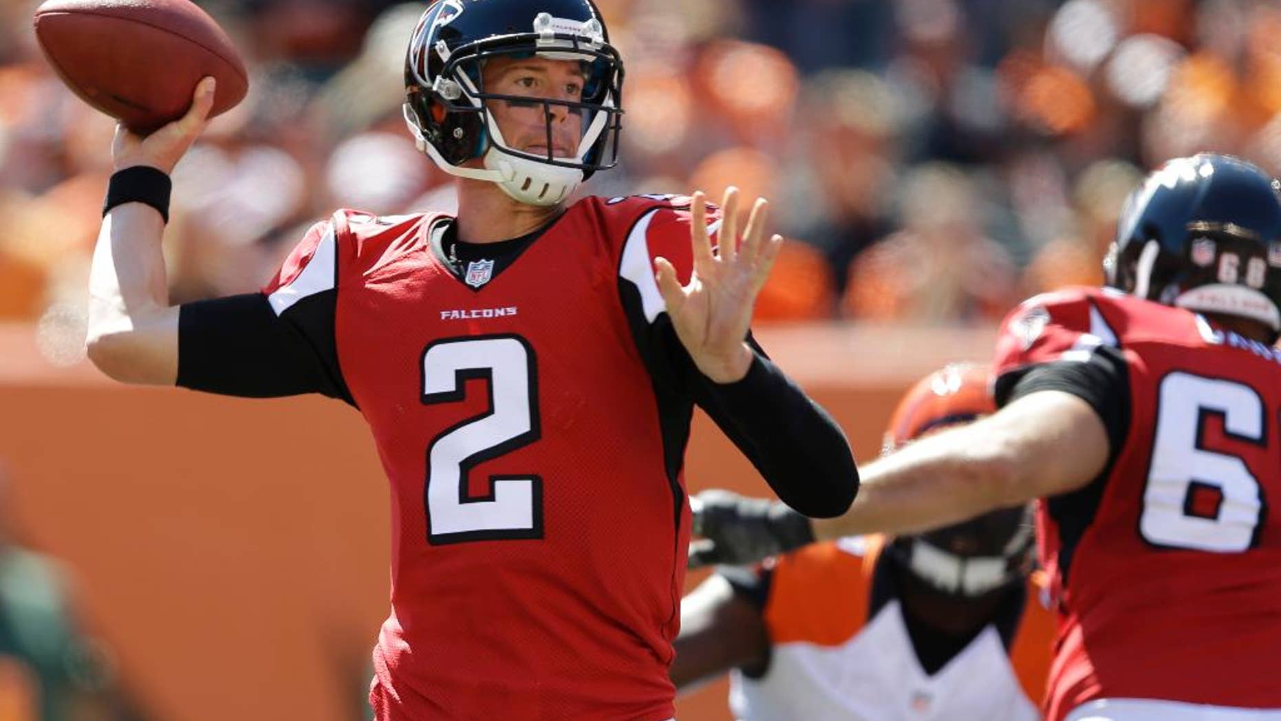 Atlanta Falcons quarterback Matt Ryan (2) passes against the Cincinnati Bengals in the second half of an NFL football game, Sunday, Sept. 14, 2014, in Cincinnati. (AP Photo/Michael Conroy)