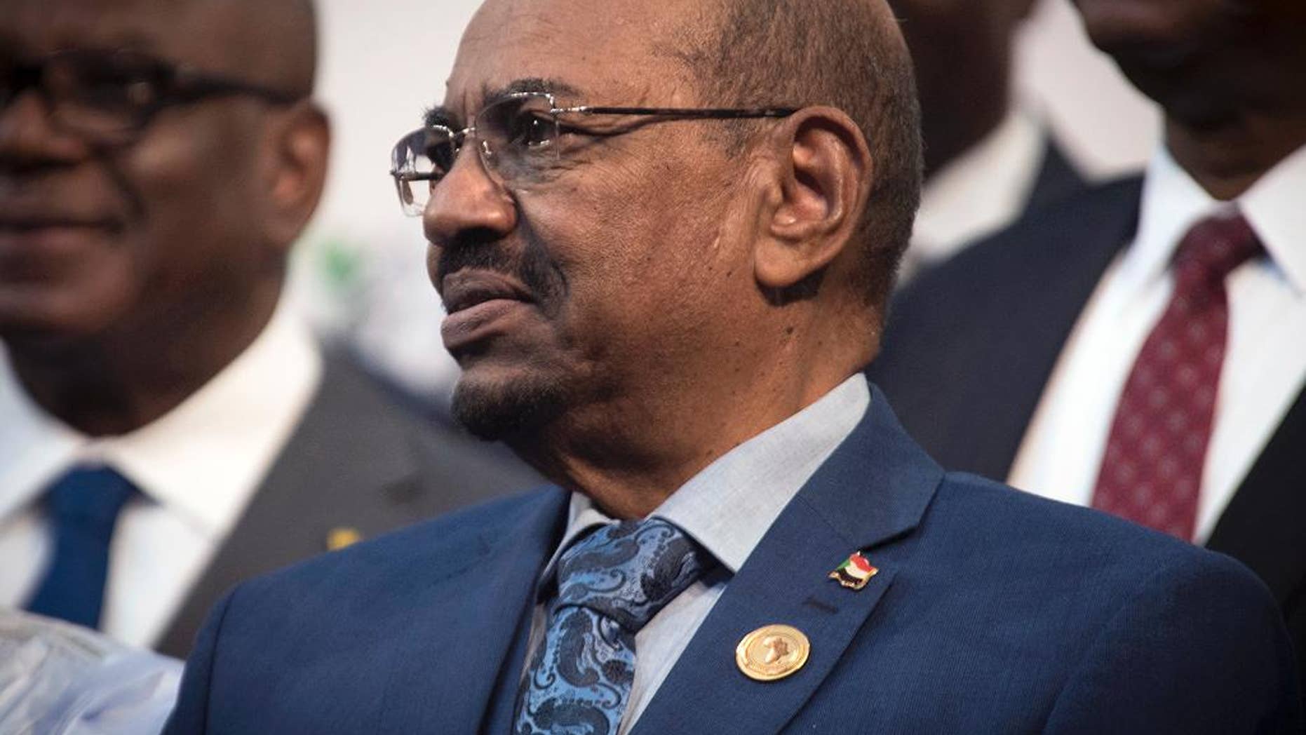 FILE - In this June 14, 2015, file photo, Sudanese President Omar al-Bashir attends a photo session at the African Union summit in Johannesburg. South Africa has decided to withdraw from the International Criminal Court following a dispute over the visit by al-Bashir, who is wanted by the tribunal for alleged war crimes, crimes against humanity and genocide. (AP Photo/Shiraaz Mohamed, File)