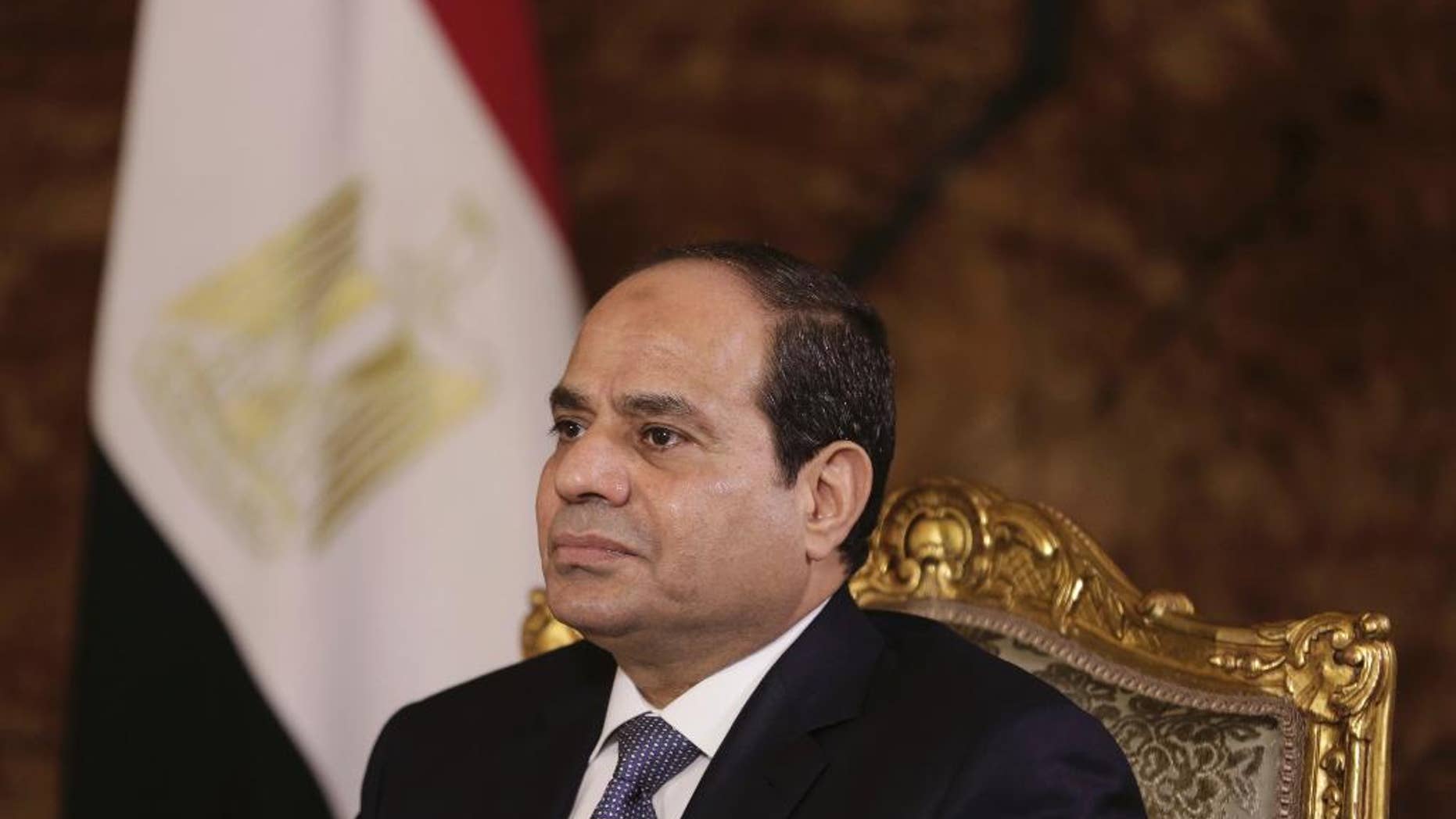 FILE - In this Sept. 20, 2014 file photo, Egyptian President Abdel-Fattah el-Sissi listens during an interview with The Associated Press at the presidential palace in Cairo. Egypt's President Abdel-Fattah el-Sissi is praising U.S. President-elect Donald J. Trump saying Trump's words as a presidential candidate will be different from his actions as a president. (AP Photo/Maya Alleruzzo, File)