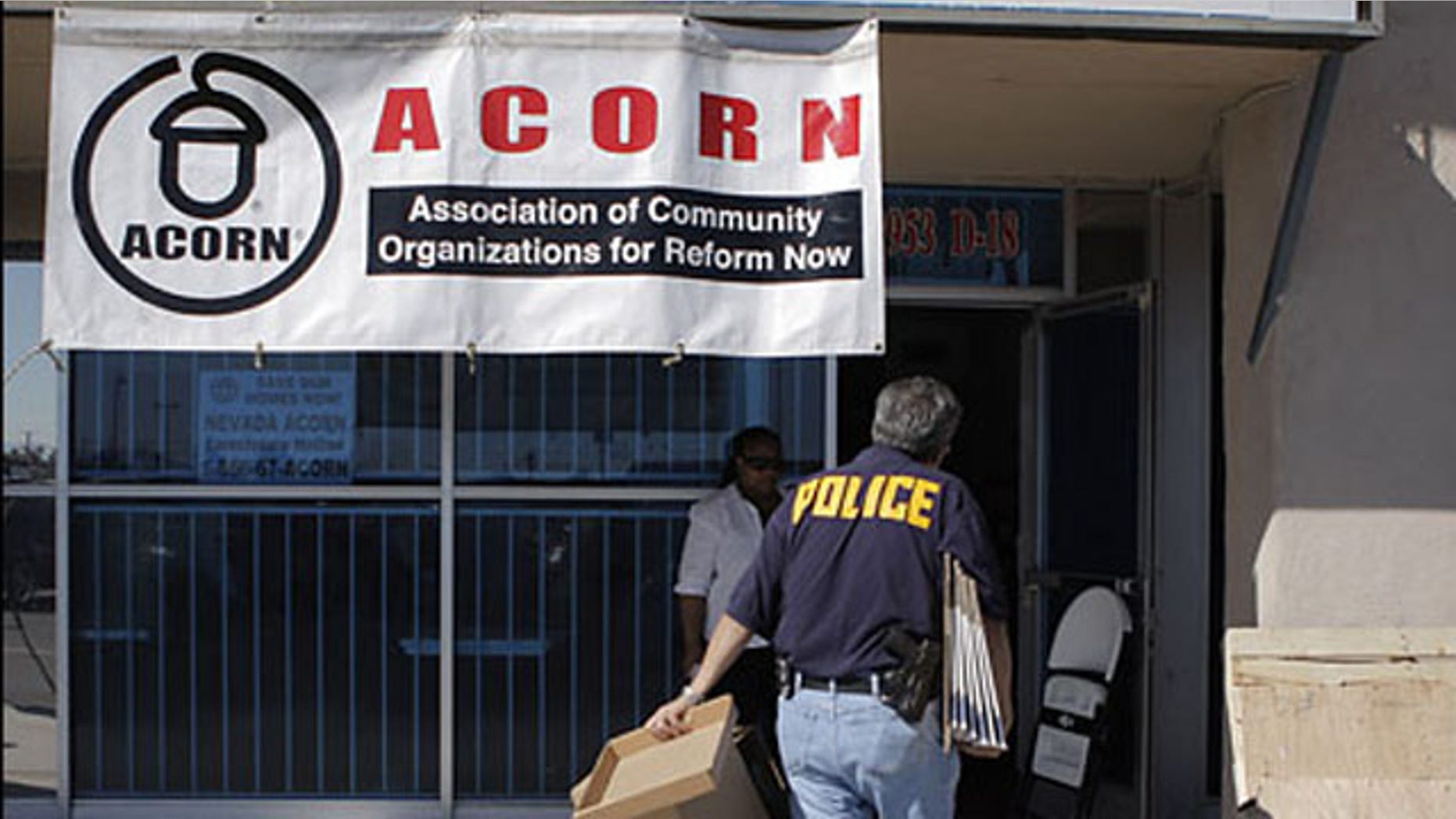 An investigator enters the ACORN office in Las Vegas, Oct. 7, 2008.
