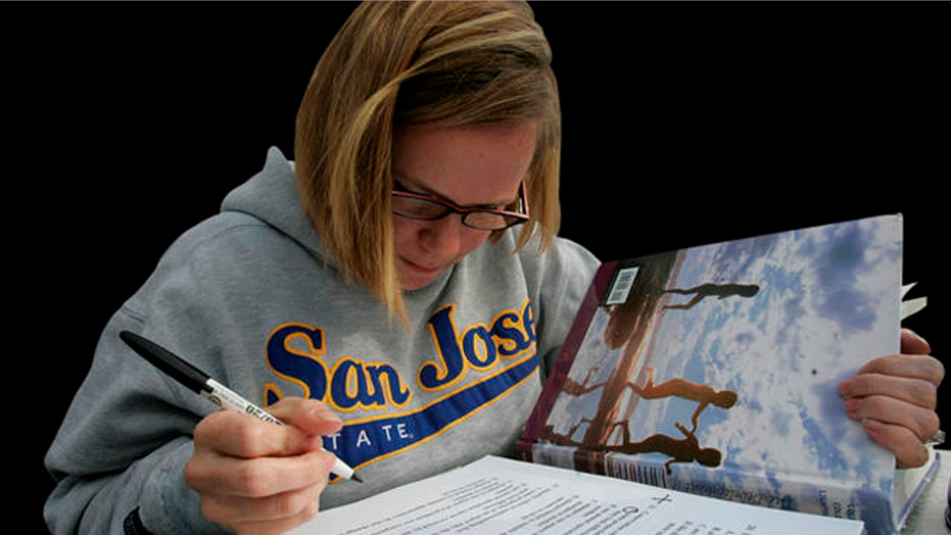 Robin Hendrickson studies for a child development class on the campus of San Jose State University in San Jose, Calif., Wednesday, Nov. 19, 2008. The California State University system, faced with a budget crisis, is proposing a plan to slash enrollment by 10,000 students from the upcoming academic year. (AP Photo/Marcio Jose Sanchez)