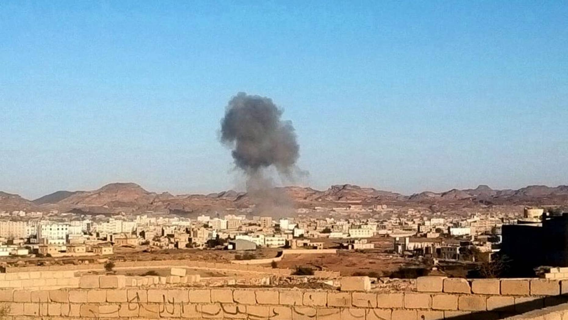Smoke rises from the site of a car bomb explosion in Radda town,100 miles (160 kilometers) south of the capital Sanaa, Yemen, Tuesday, Dec. 16, 2014. Two suicide car bombers rammed their vehicles into a Shiite rebels’ checkpoint and a house south of the Yemeni capital Tuesday, as a school bus traveling nearby killing at least 25 dead including at least 15 primary school students, Defense Ministry, rebels and witnesses. (AP Photo)