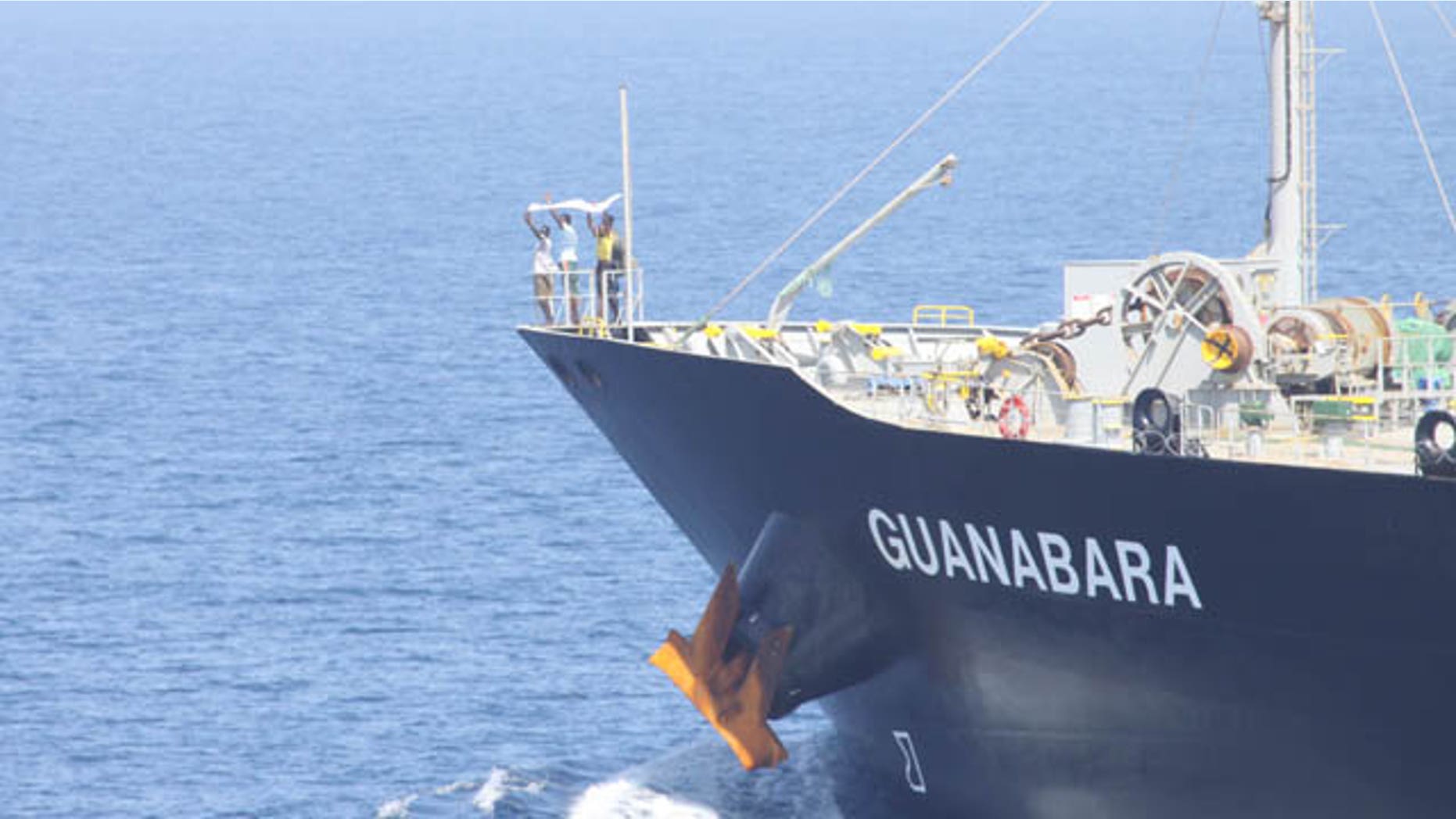 March 6: Suspected pirates indicate their surrender on the bow of Japanese-owned commercial oil tanker M/V Guanabara. Combined Maritime Forces warship USS Bulkeley, with support from Turkish warship TCG Giresun of NATO’s counter-piracy Task Force 508, responded to the reported pirating of Guanabara, which resulted in the detention of the four suspected pirates and freeing of 24 crew members. (U.S. Navy)