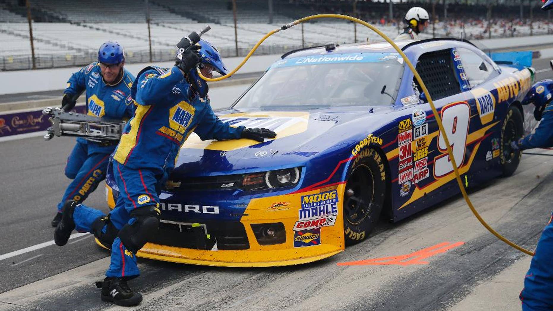 Chase Elliott makes a pit stop during the NASCAR Nationwide series auto race at Indianapolis Motor Speedway in Indianapolis, Saturday, July 26, 2014. (AP Photo/Robert Baker)