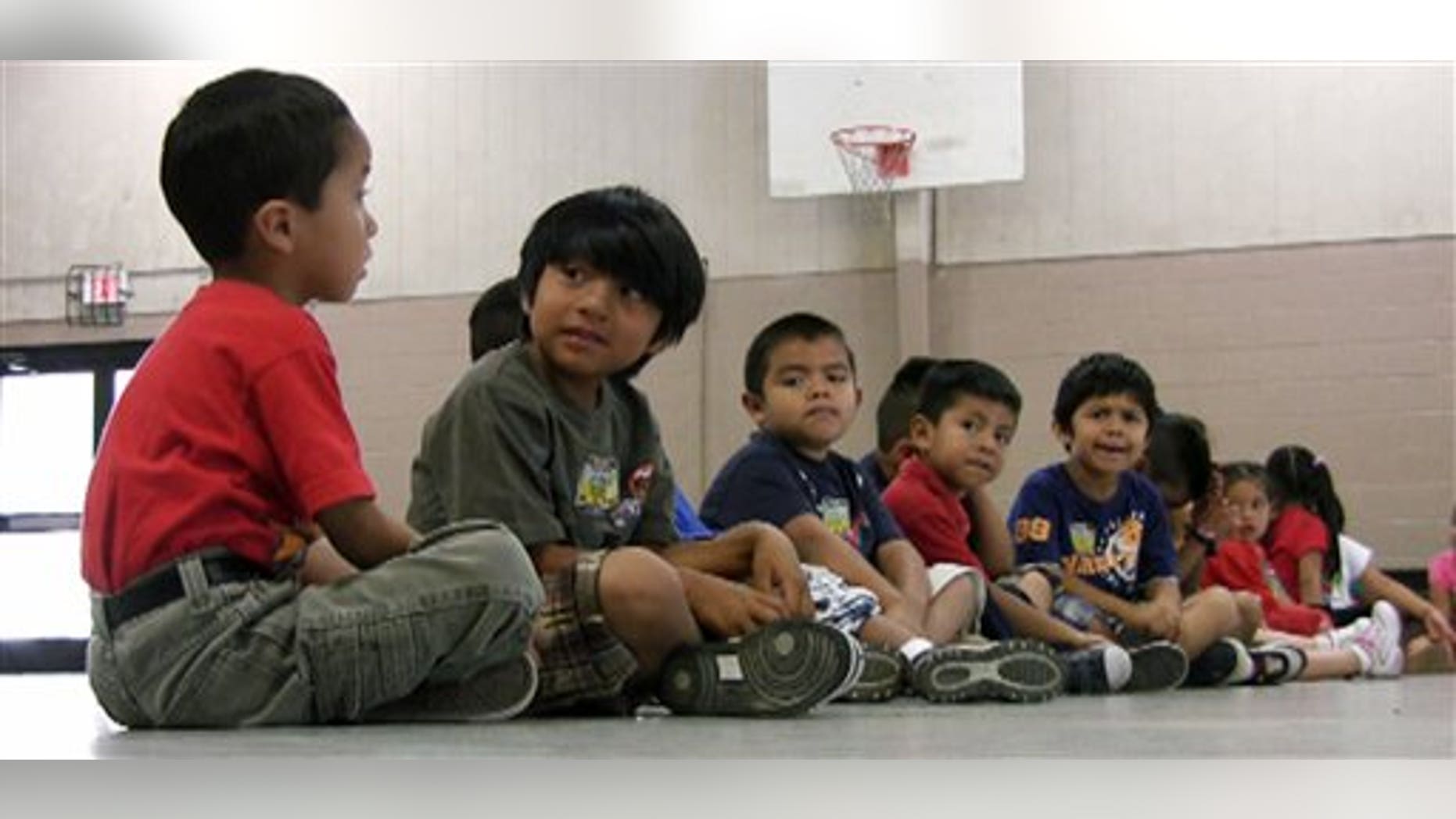 Aug 17: Students sit in the gym at Crossville Elmentary School in Crossville, Ala. In the last week, since Alabama enacted the nation's strictest state-level immigration law, growing numbers of Latino children of migrants have stayed away from school.